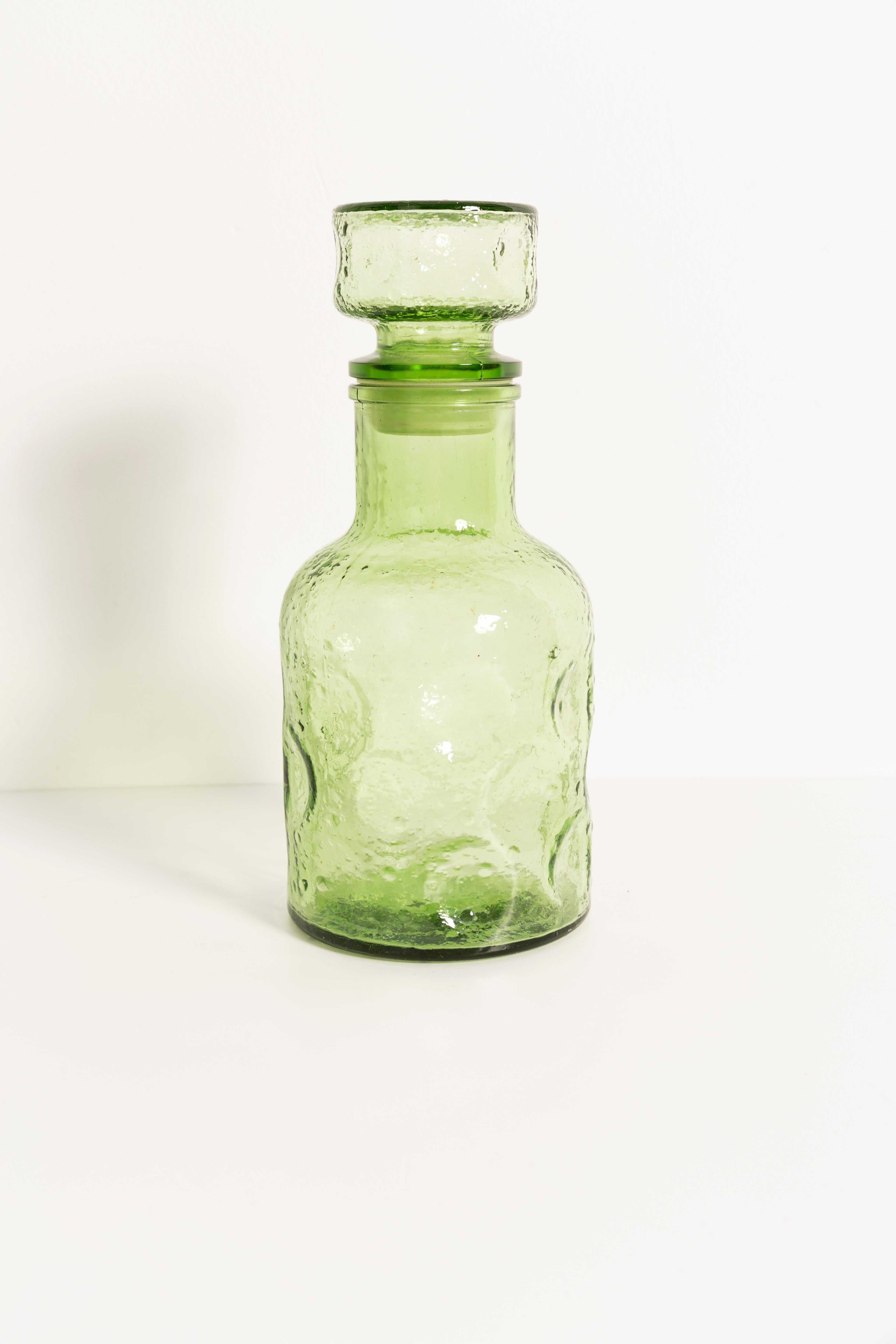 green glass decanter with stopper