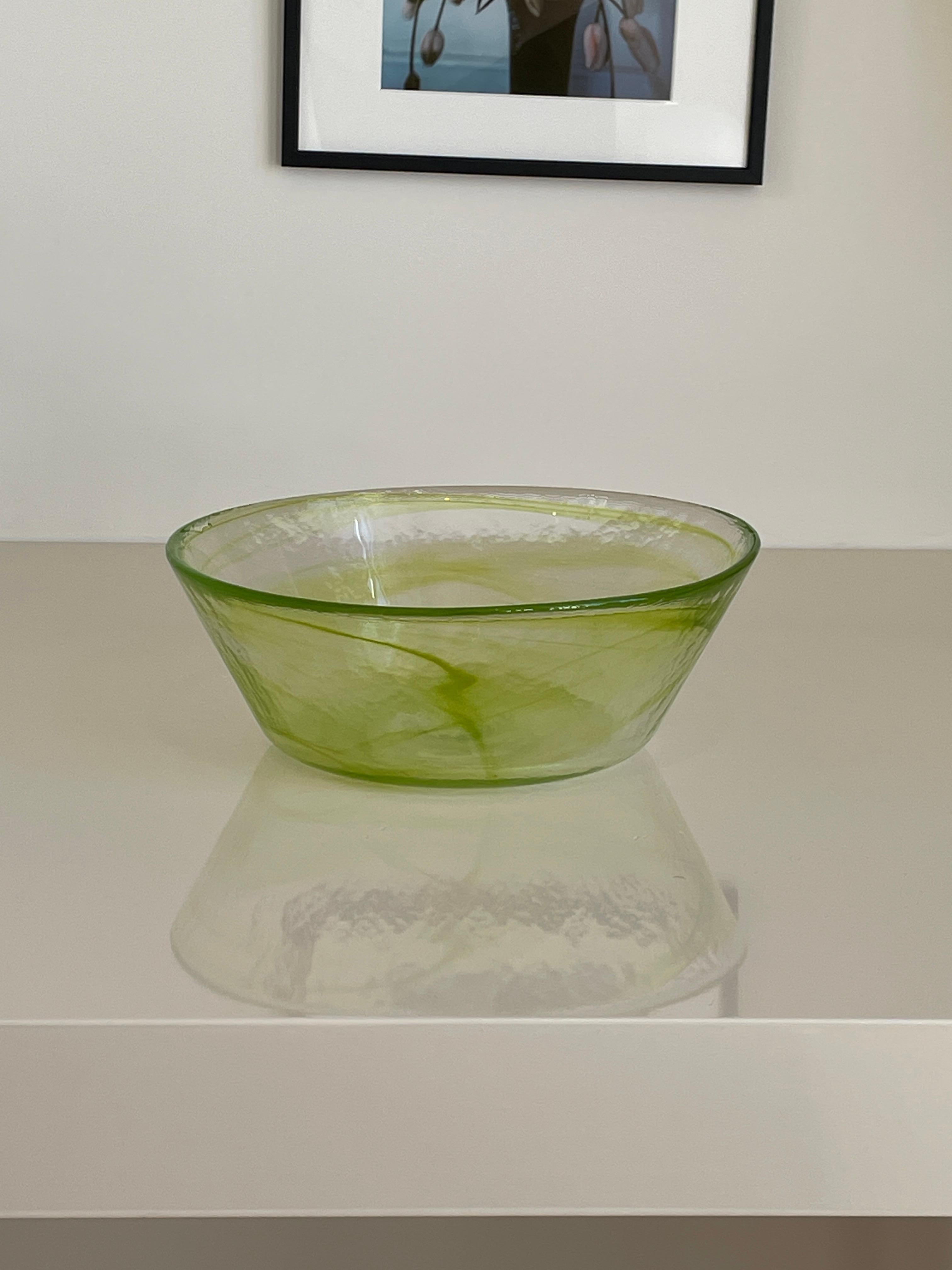 Height: 10cm
Diameter: 26cm

Designer: Ulrica Hydman-Vallien
Date: 1990s
Materials: Glass

Description: Famed glass artist Hydman-Vallien’s beautfiful function design of a spun green glass bowl
