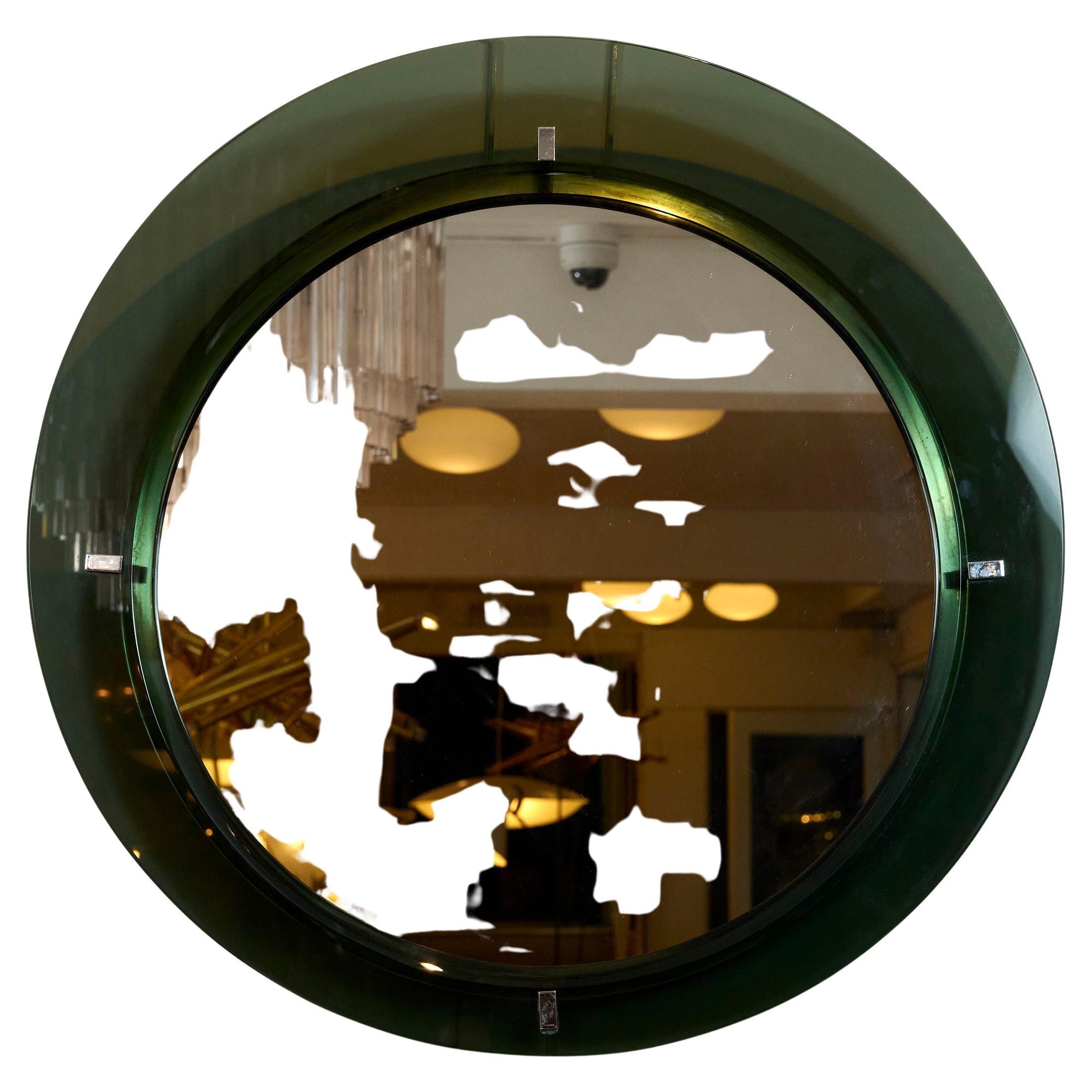 Circular mirror with green glass frame in the style of Fontana Arte.

