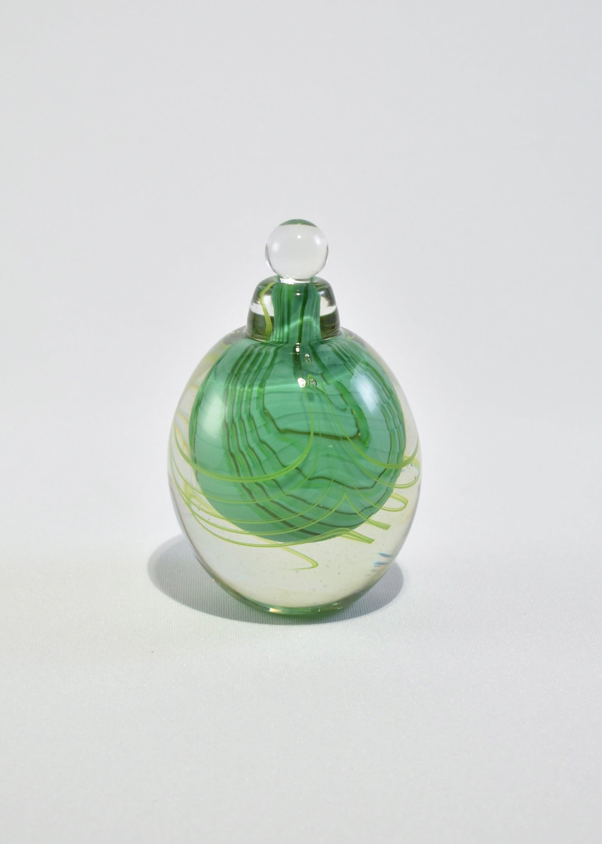 Stunning blown glass perfume bottle with abstract design. Signed on base.