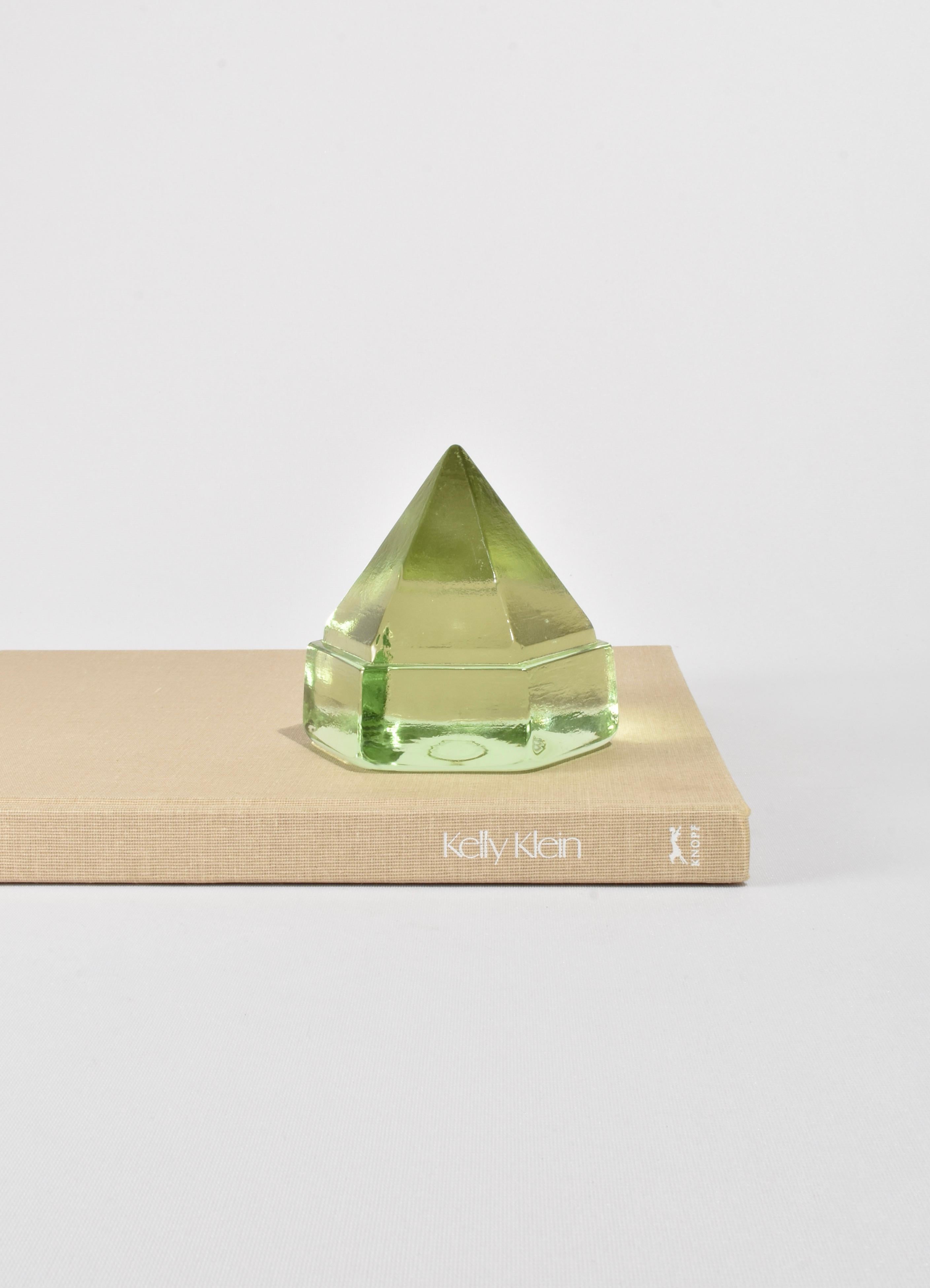 Beautiful light green glass prism. May be used as a paperweight or displayed on its own as a sculptural piece.