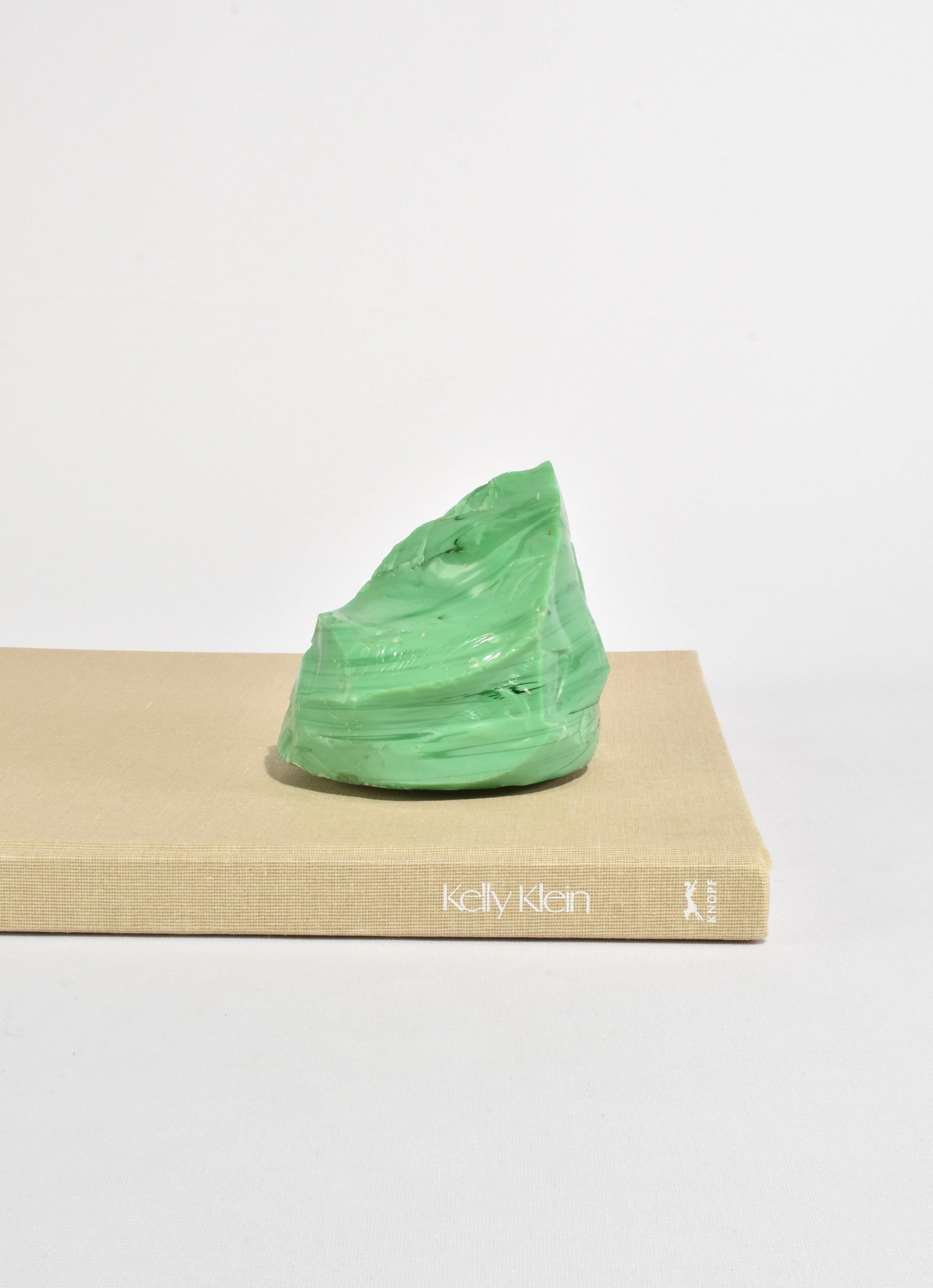 Slag glass sculpture in a beautiful green color. Display on its own or with an arrangement of books as a small bookend.