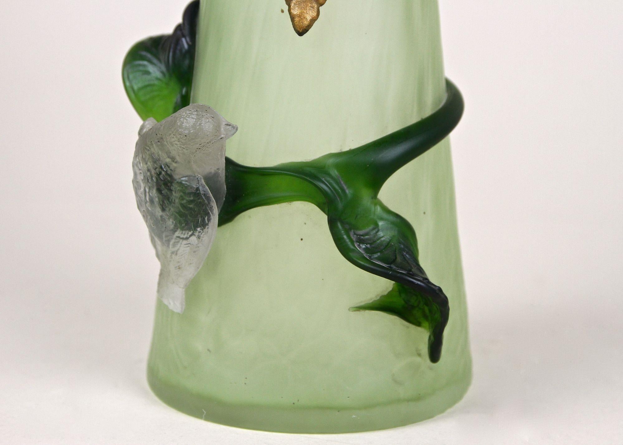 Gorgeous, unusual Art Nouveau Glass Vase from the well known Bohemian glass manufactory of Rindskopf & Söhne in Teplitz around 1905. The beautiful green shining glass vase impresses with its fantastic shaped body which is additionally adorned by a