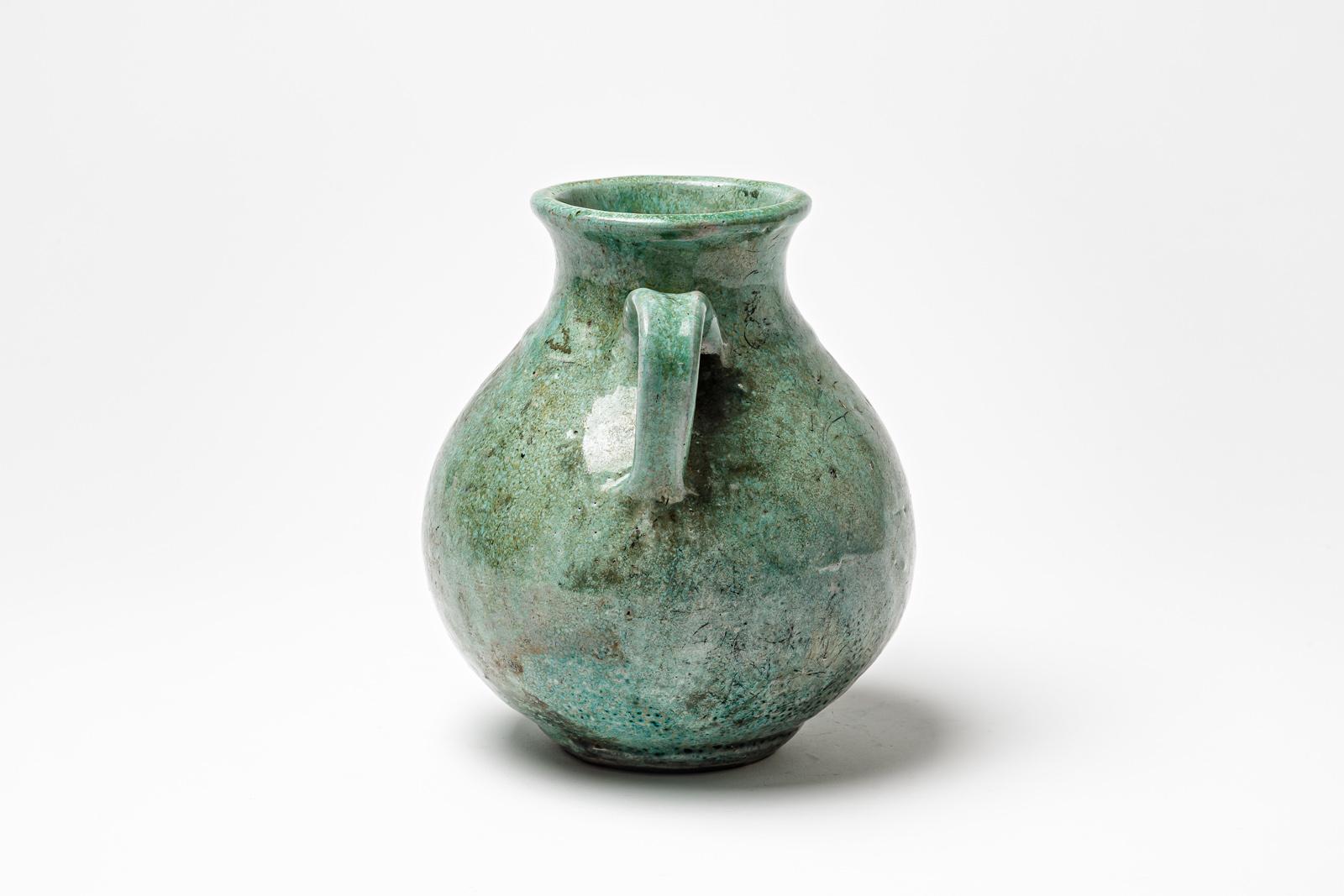 Beaux Arts Green glazed ceramic handle pot by Gisèle Buthod Garçon, circa 1980-1990 For Sale