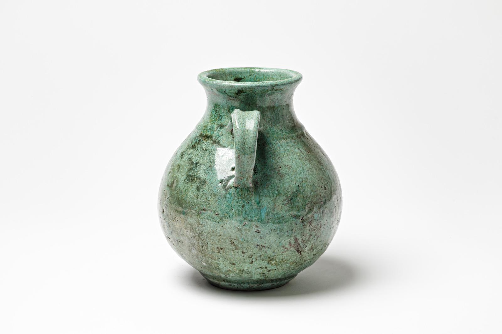 Green glazed ceramic handle pot by Gisèle Buthod Garçon, circa 1980-1990 In Excellent Condition For Sale In Saint-Ouen, FR