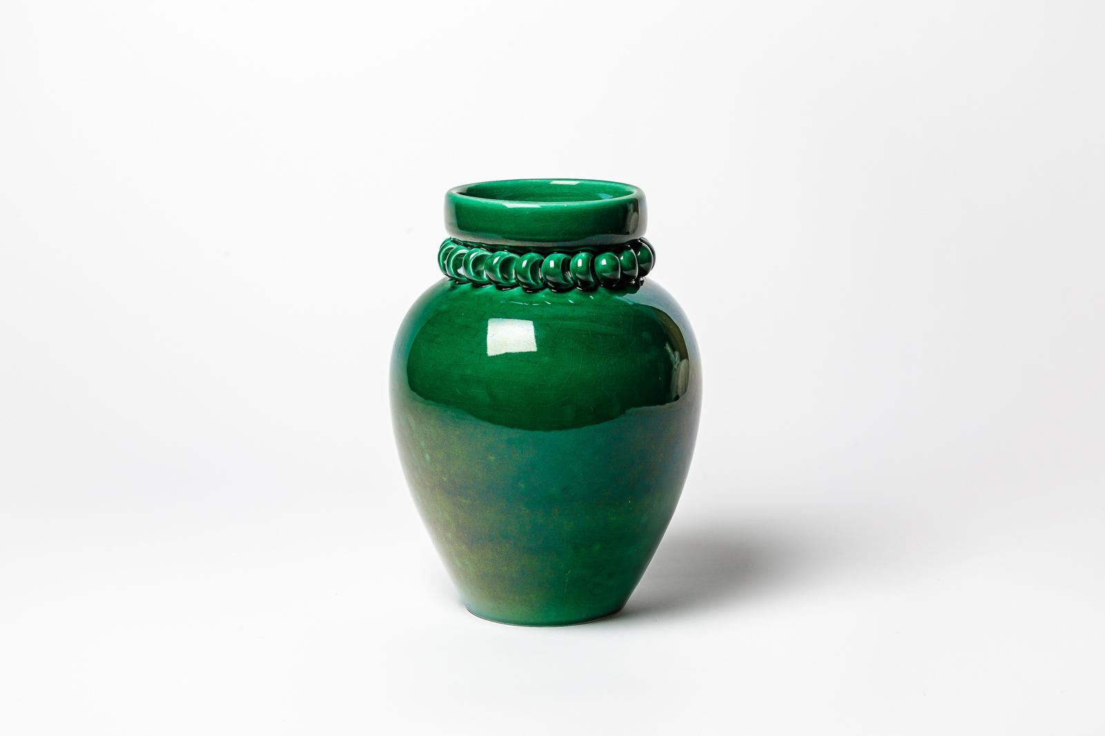 Green glazed ceramic vase by Pol Chambost. 
Artist monogram under the base. Circa 1930-1940. 
H : 10.6’ x 6.7’ inches.
