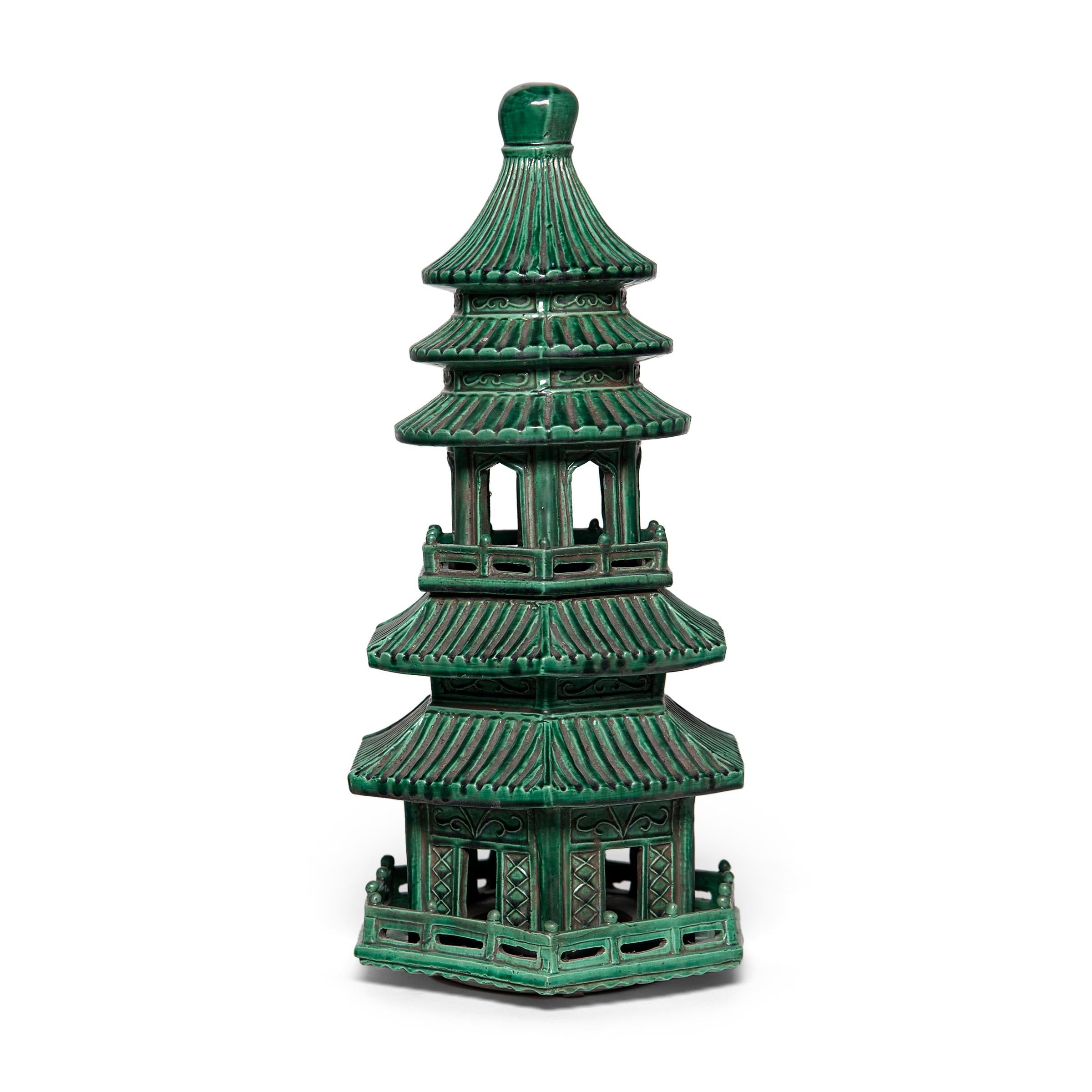 This miniature ceramic pagoda tower was originally the uppermost portion of a large pagoda-shaped incense burner with several tiers. Incense burnt at the base of each tier would drift upwards through the pagoda and spill out from its many doorways