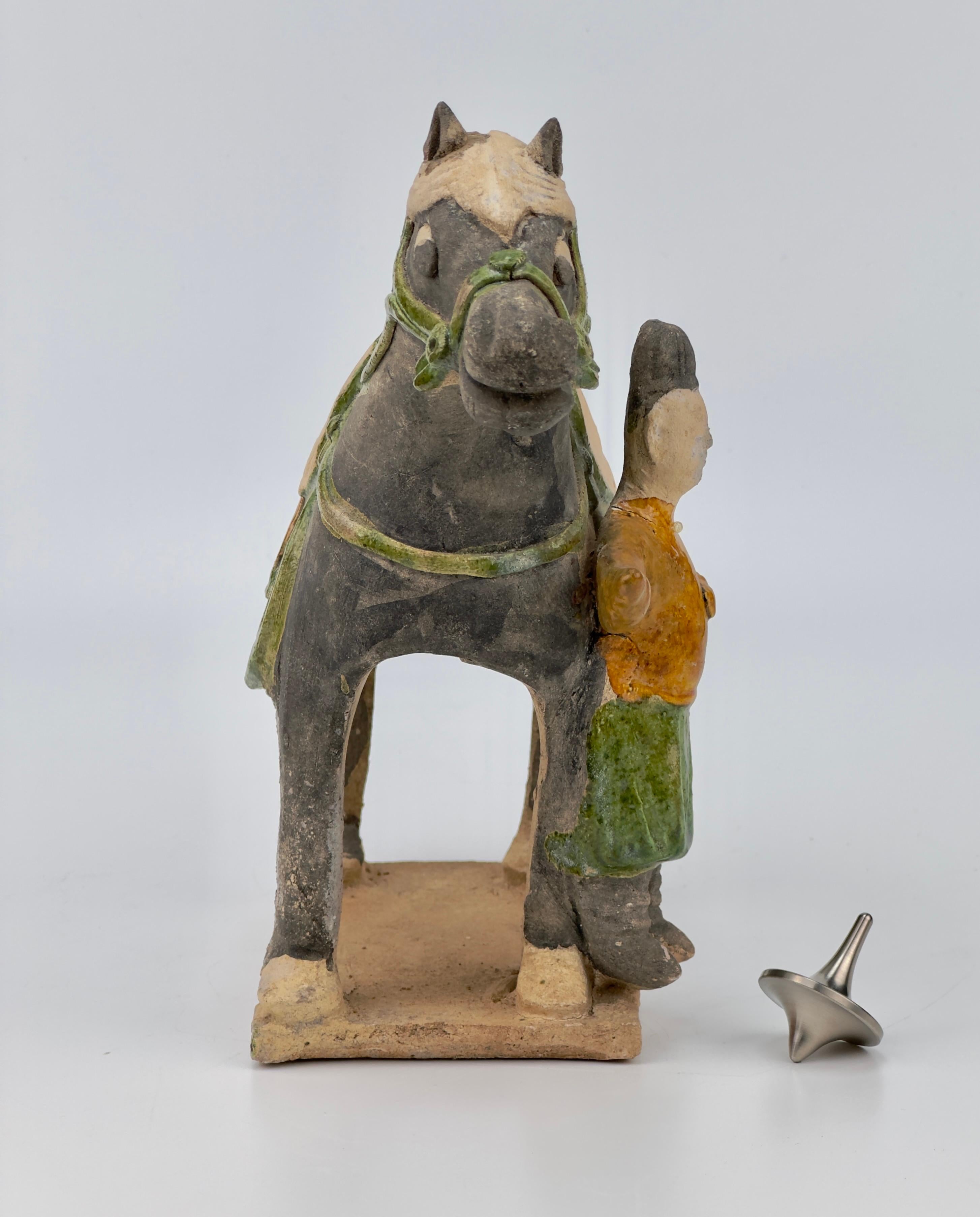 Statues of Chinese horse and rider, featuring glazes in green, amber, are set on rectangular bases. 

Period: Ming Dynasty 
Medium: Green-glazed Pottery
Type: Figure
Provenance : Acquired in early 2000s from Hongkong
Reference : Christies Newyork