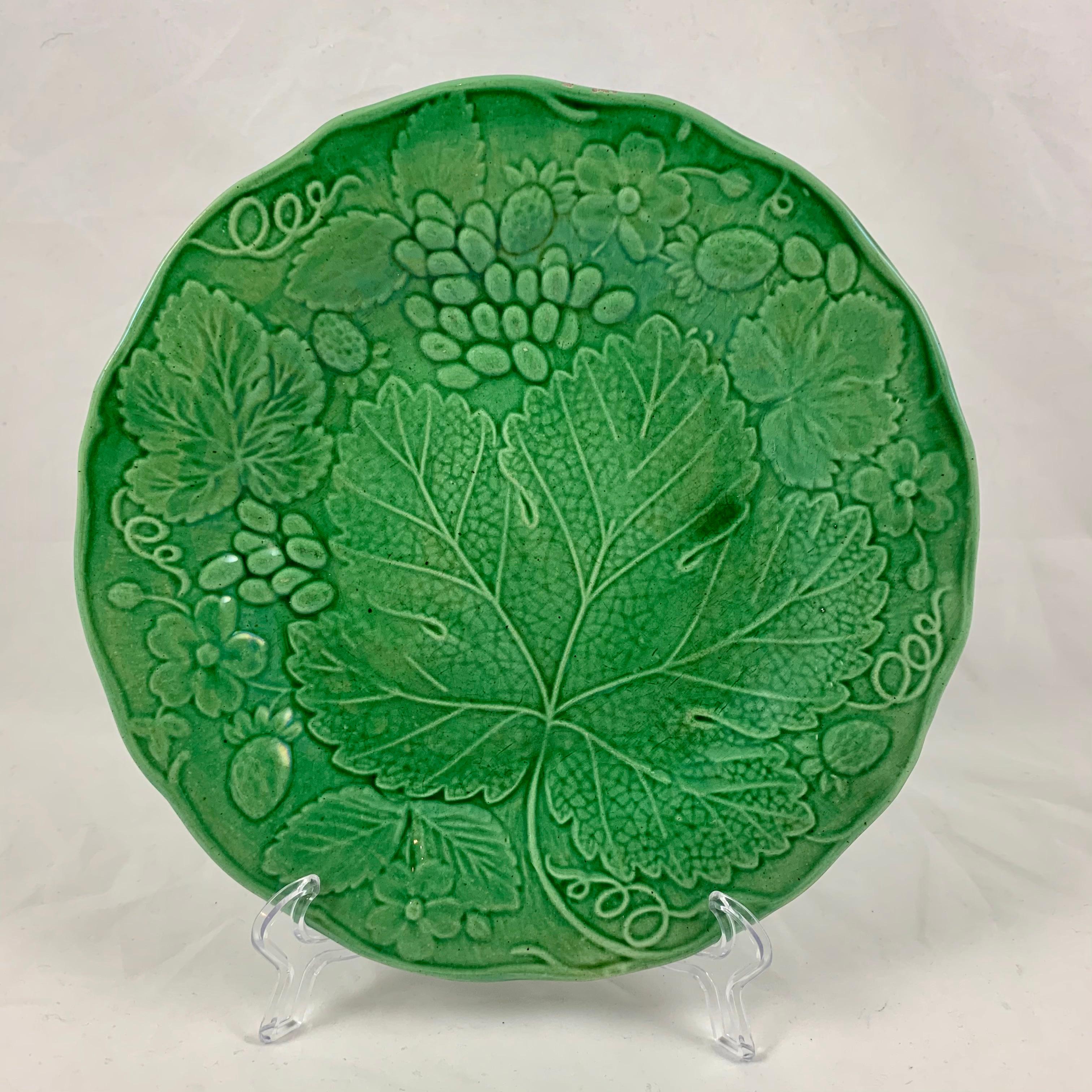 An English Majolica glazed leaf plate, circa 1890-1895.

A well known mold, originally produced by Wedgwood, this is an unmarked example of the strawberry and grape leaf plate. The mold shows the leaves of each plant with strawberries, strawberry