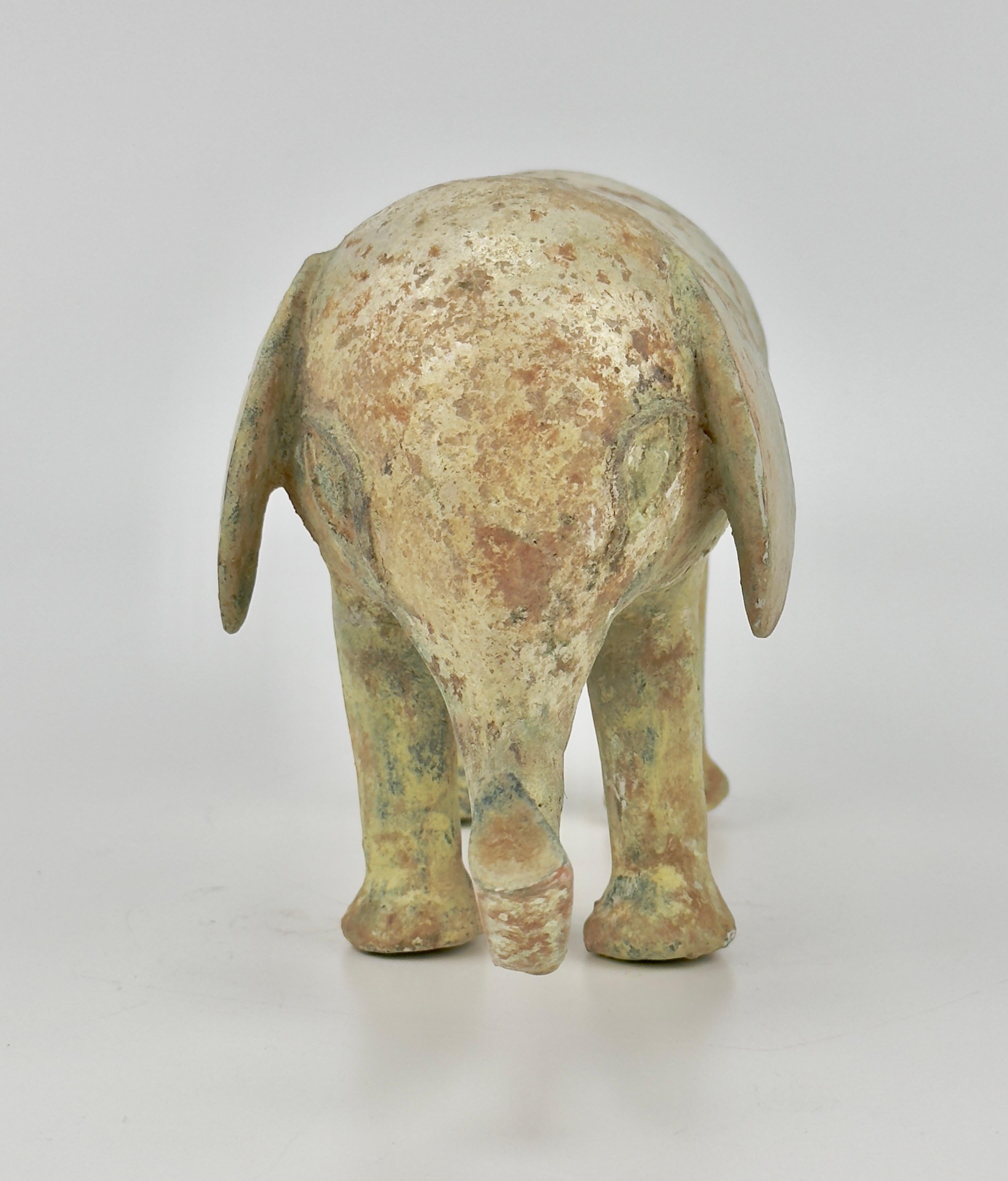 This piece is an elephant statue made of green-glazed pottery. During the Han Dynasty, artworks depicting elephants were quite rare. However, such representations did occasionally appear. For example, the bronze vessel from the Han Dynasty housed in