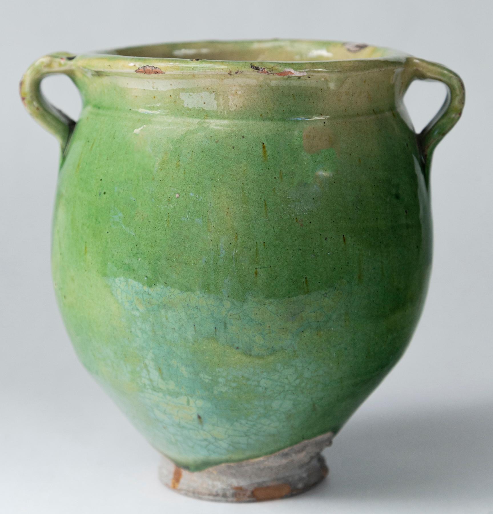 Green Glazed pottery storage jar, France, Early 20th Century. Multi-hued green glazed jar from the South of France.