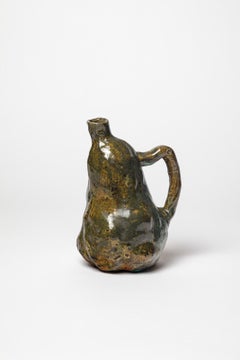Green glazed stoneware pitcher by Eugène Lion, circa 1920