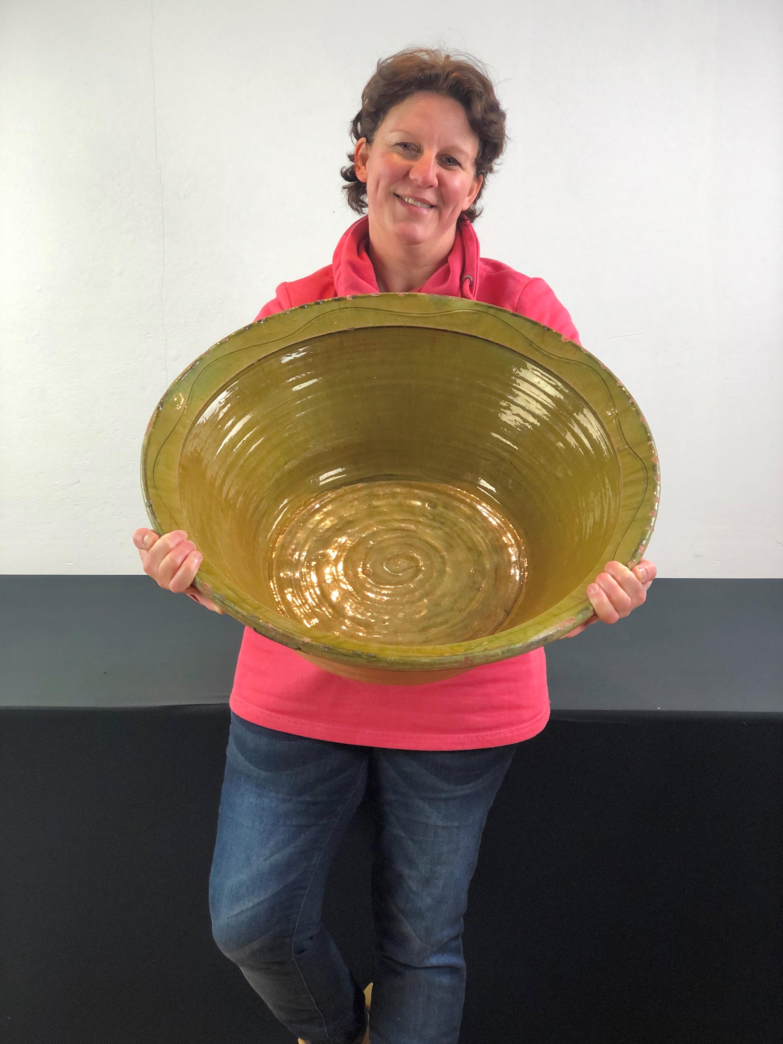 Great looking large glazed terracotta bowl. 
Awesome by his large size and by the color ! 

This old Spanish terracotta bowl was used to display olives to sell. 
It has a beautiful green color - olive green color with a touch of dark lemongreen and
