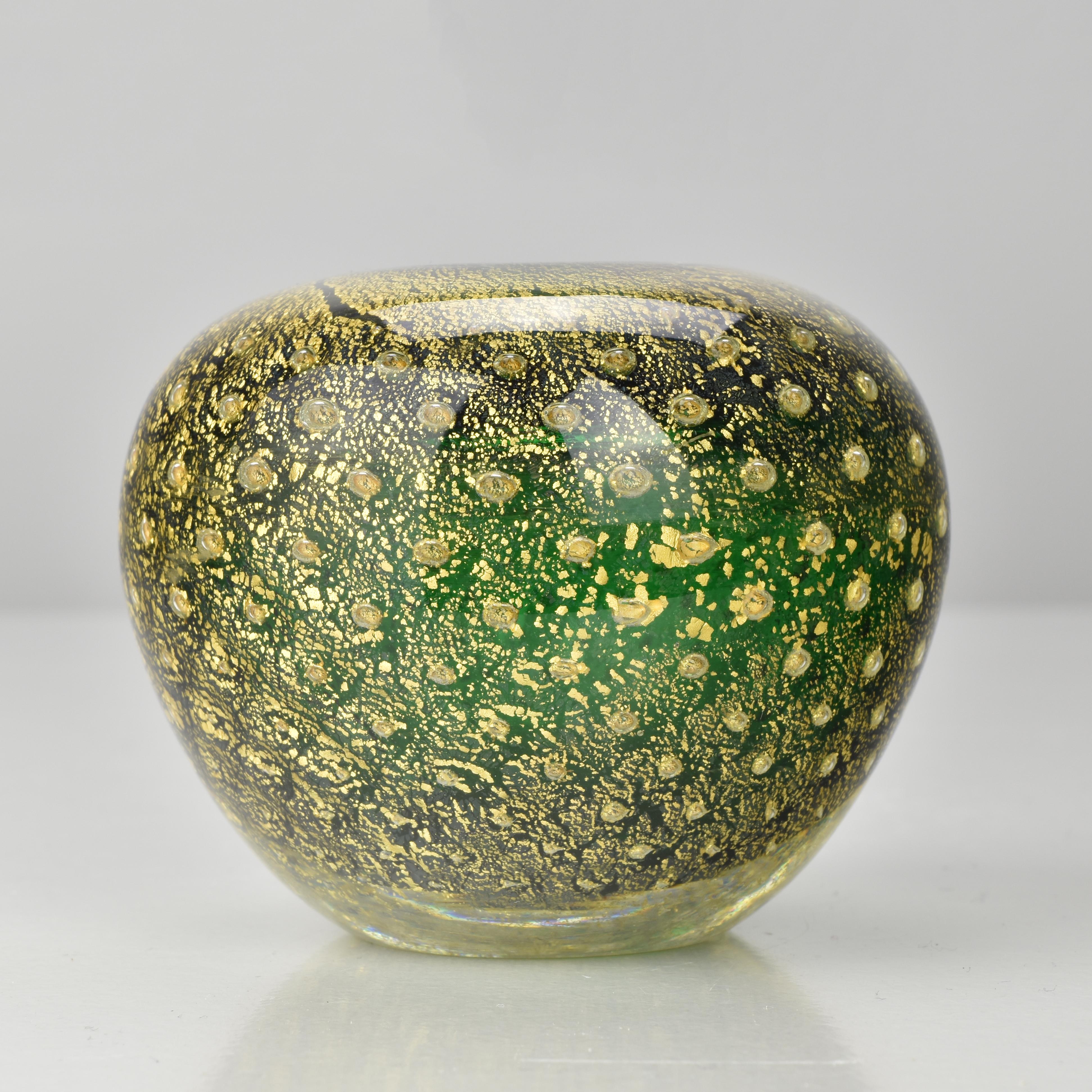 A striking vintage Murano art glass vase attributed to Carlo Scarpa for Venini, showcasing the refined elegance and technical mastery characteristic of Scarpa’s early designs. This rounded, weighty piece features a deep emerald-green core enveloped