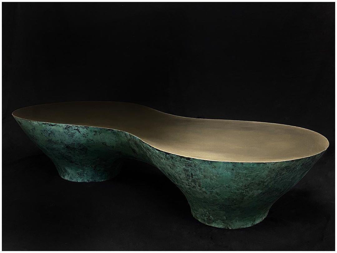 Green gold tombos coffee table, Signed by Stefan Leo.
Brass patinated (Also available in Black version).
Measures: 180 x 88cm, H 40 cm.
(Other dimensions, materials can be made to order).

Atelier Stefan Leo has a remarkable reputation thanks to its
