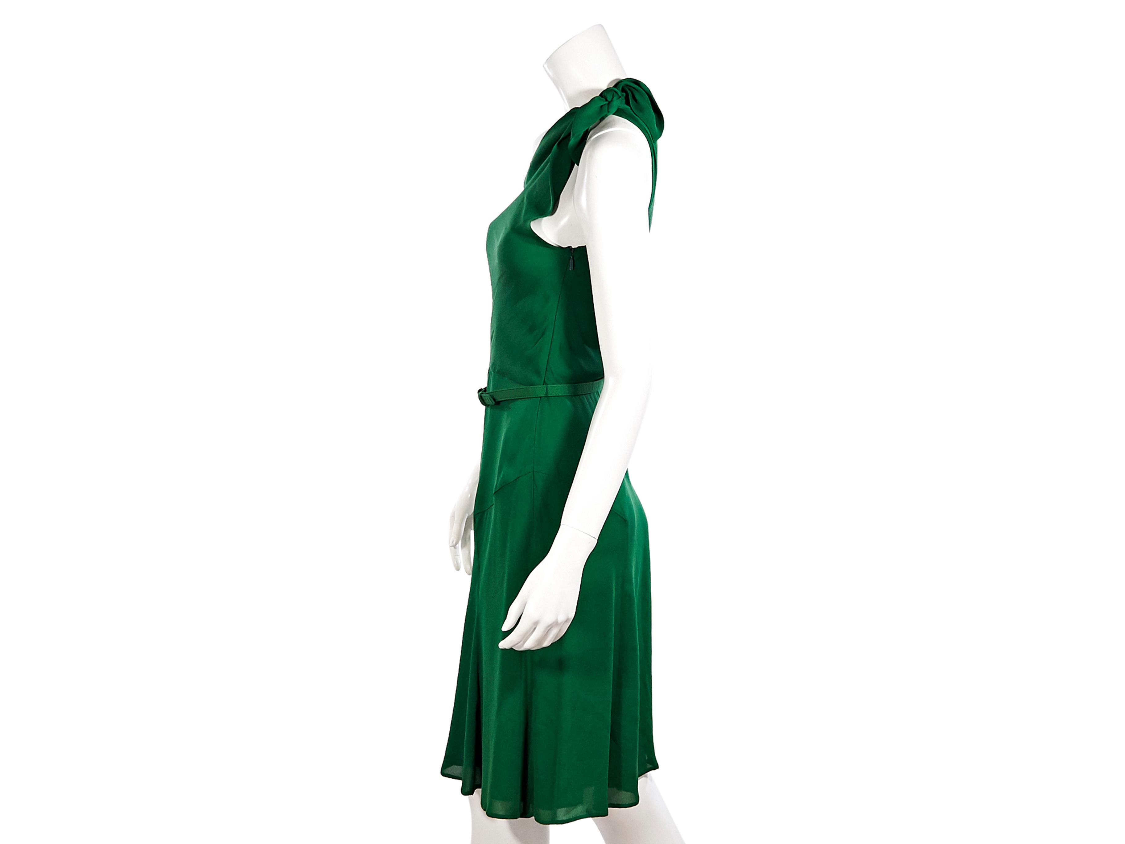 Product details:  Green silk one-shoulder dress by Gucci.  Sleeveless.  Adjustable belted waist.  Concealed side zip closure.  Label size IT 40.  32