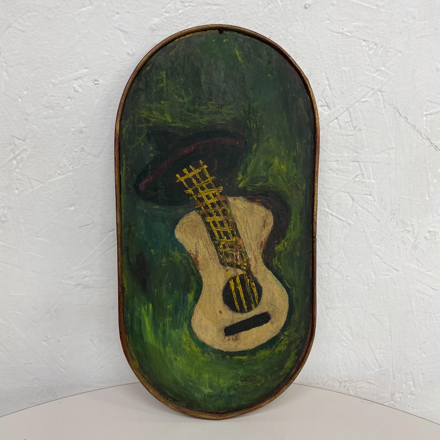 Painting.
Green Guitar Artwork painted on wood vintage wallPlaque 1970s
Measures: 12.13 x 6.13 x .38
No signature.
Preowned original vintage condition
Refer to images.