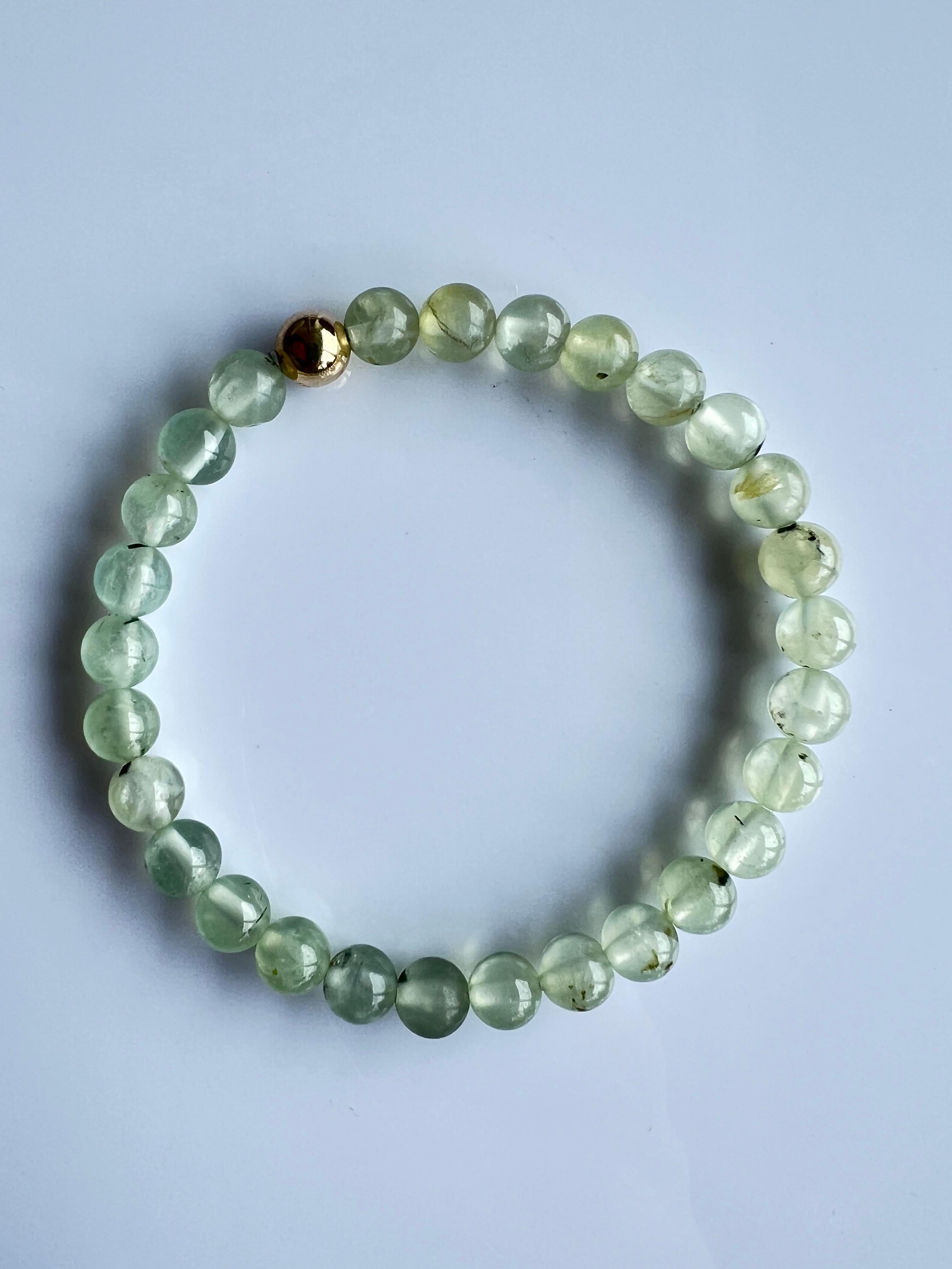Green Prehnite Beaded Bracelet Heart Chakra Semi Precious Natural Gold Filled


Introducing the J Dauphin Green Heart Chakra Beaded Bracelet, a stunning symbol of serenity and spiritual connection. Lovingly handcrafted in Los Angeles, this piece is