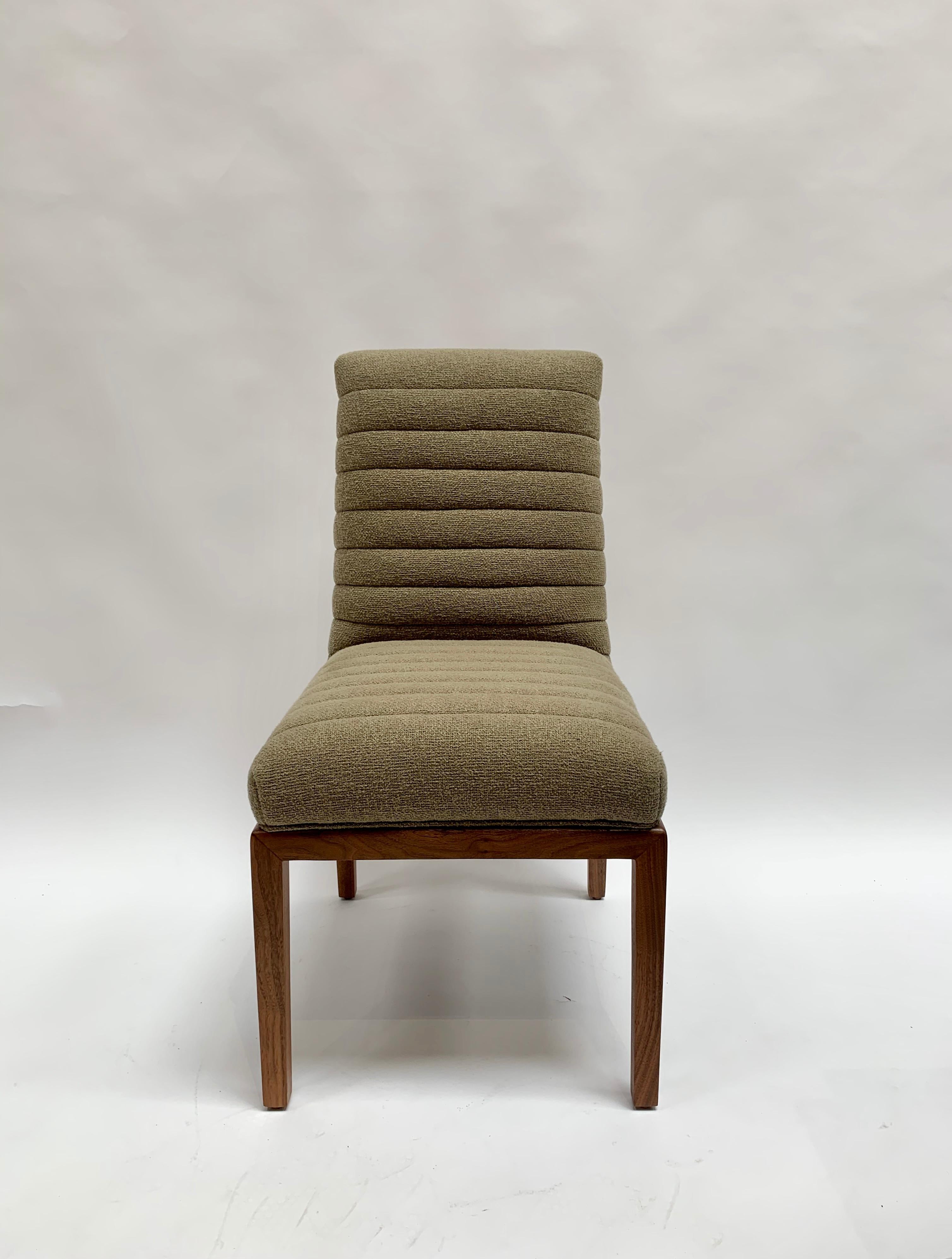 The Highback Shoreland chair is part of the collaborative collection with interior designer Brian Paquette. The dining chair features a channel tufted back and seat with a solid American walnut or white oak frame. This piece is available in