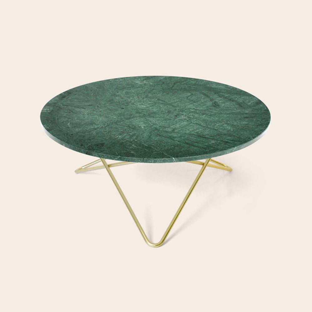 Green Indio marble and brass large O table by OxDenmarq
Dimensions: D 100 x H 40 cm
Materials: Brass, green Indio marble
Available in other size. Different top and frame options available

OX DENMARQ is a Danish design brand aspiring to make