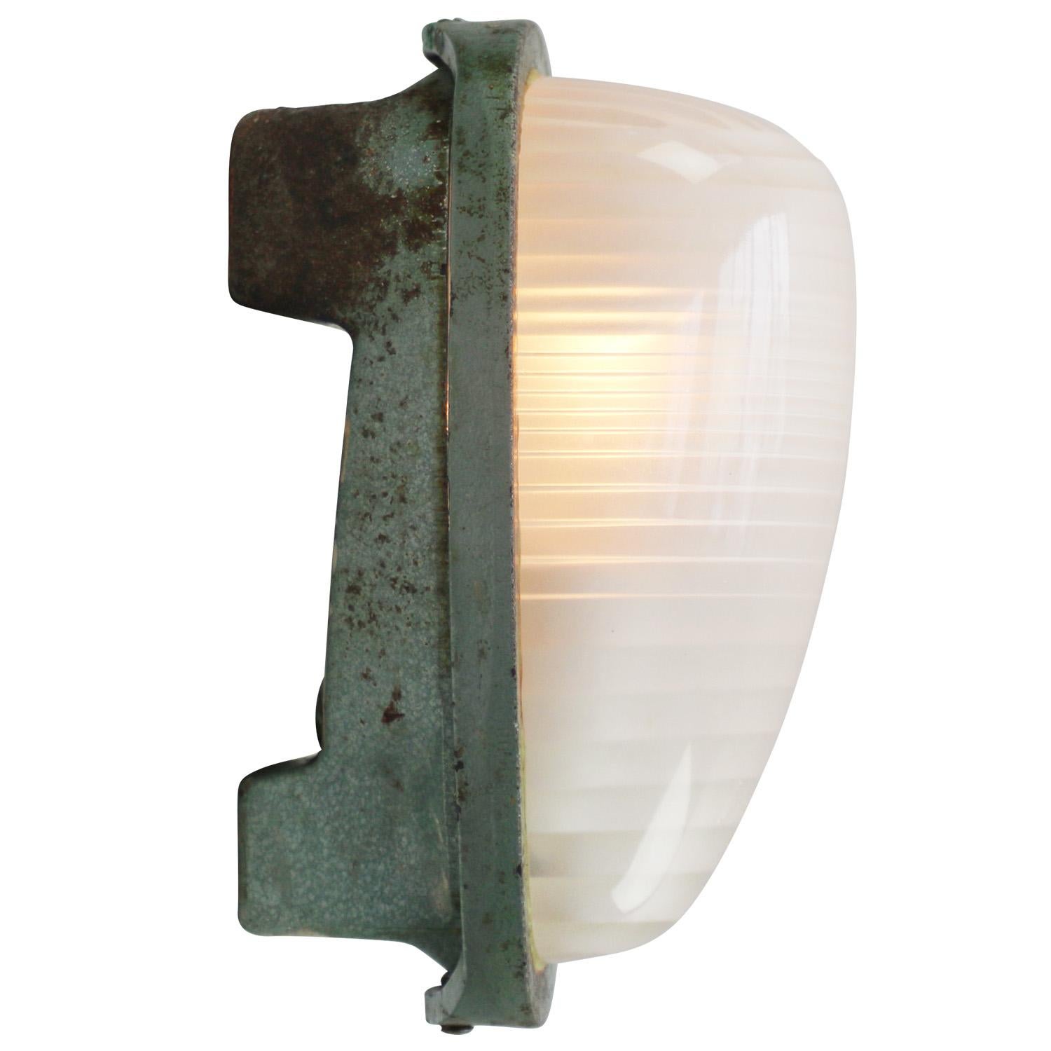 French Industrial wall / ceiling lamp by Holophane, France, model AE100
Green cast iron with frosted cut glass.

Weight : 3.00 kg / 6.6 lb

Priced per individual item. All lamps have been made suitable by international standards for incandescent