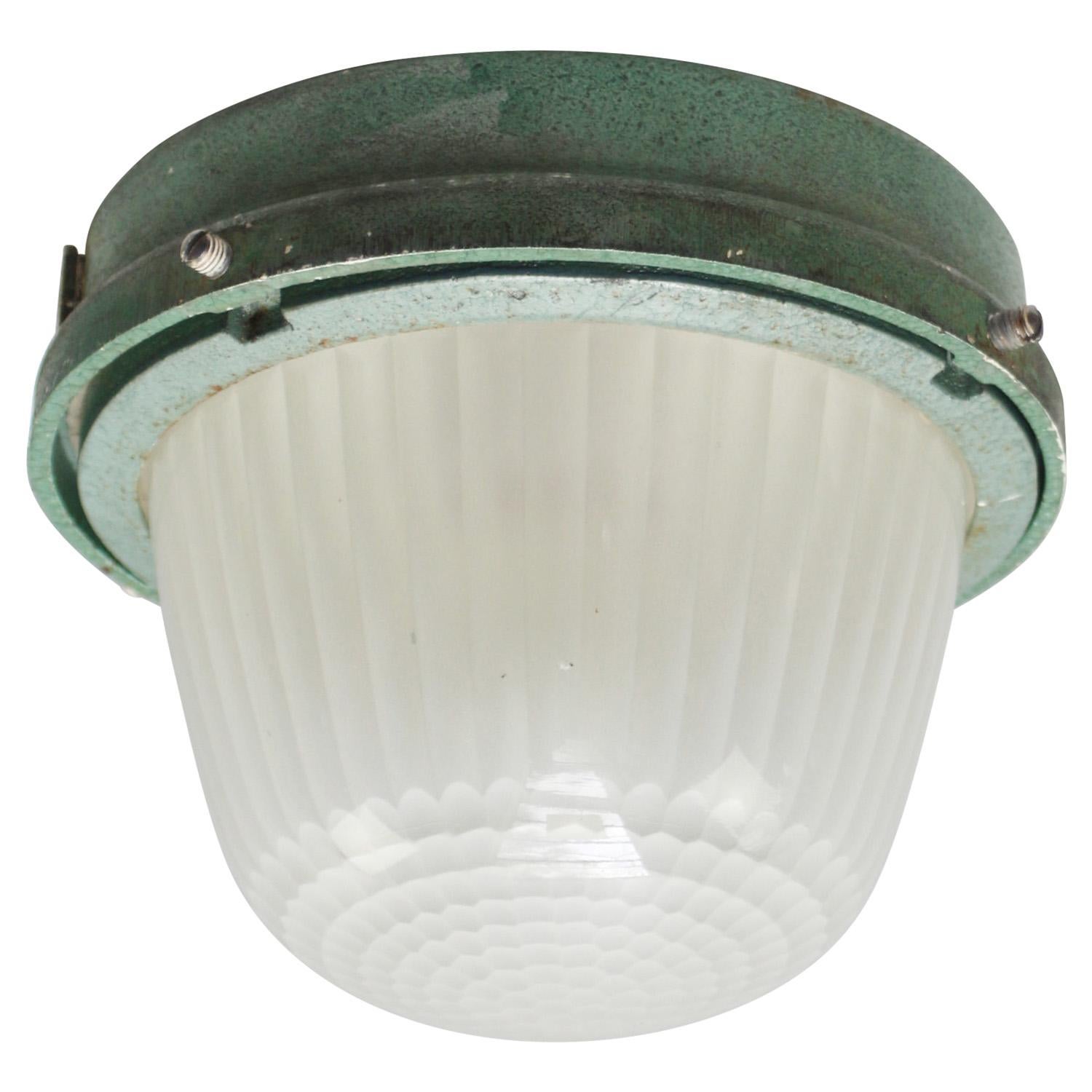 French Industrial wall / ceiling lamp by Holophane, France, model CE100
Green cast iron with frosted cut glass.

Weight : 4.10 kg / 9 lb

Priced per individual item. All lamps have been made suitable by international standards for incandescent light