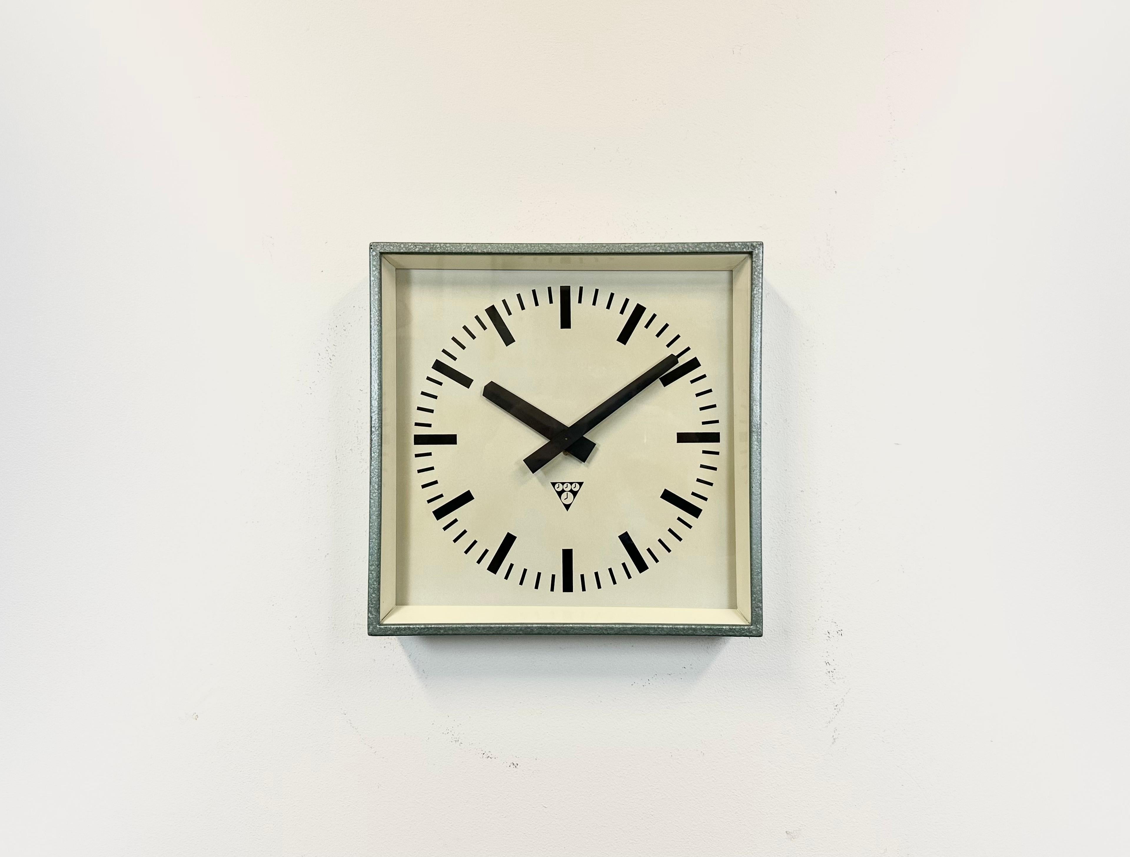 - Clock made by Pragotron in former Czechoslovakia during the 1970s 
- Was used in factories, schools and railway stations 
- Green hammerpaint metal body 
- Aluminium dial and hands 
- Clear glass cover 
- Former slave clock has been converted