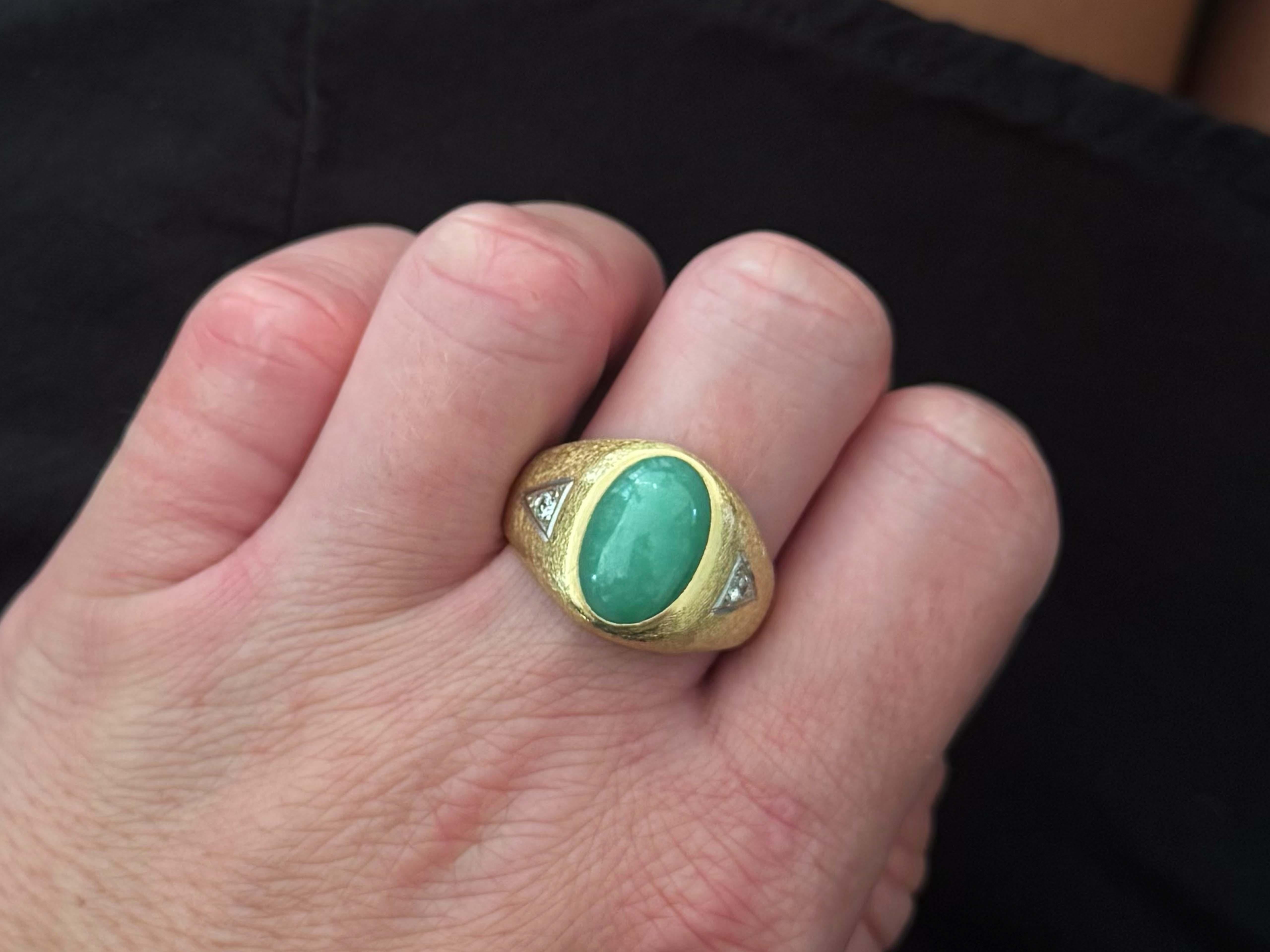 Ring Specifications:

Metal: 14k Yellow Gold

Total Weight: 9.8 Grams

Diamond Count: 2

Diamond Carat Weight: 0.15 carats

Diamond Color: H

Diamond Clarity: SI2

Jade Carat Weight: ~6.25 carats

Jade Measurements: 14.5 mm x 9.5 mm x 5 mm 

Ring