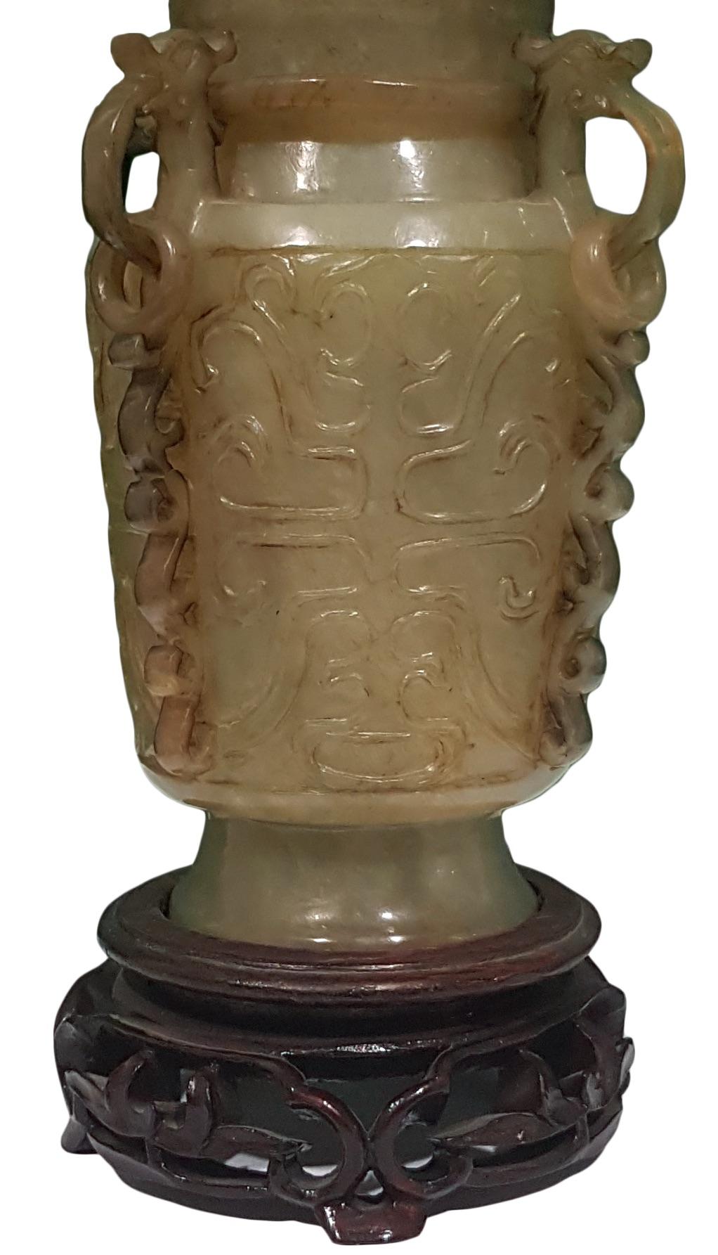 Green Jade with wooden base friezed with decorations representing plants and vegetation.
Measure: 25 x 10 x 10 cm (with base) – 22 x 10 x 10 cm (without base).

This artwork is shipped from Italy. Under existing legislation, any artwork in Italy