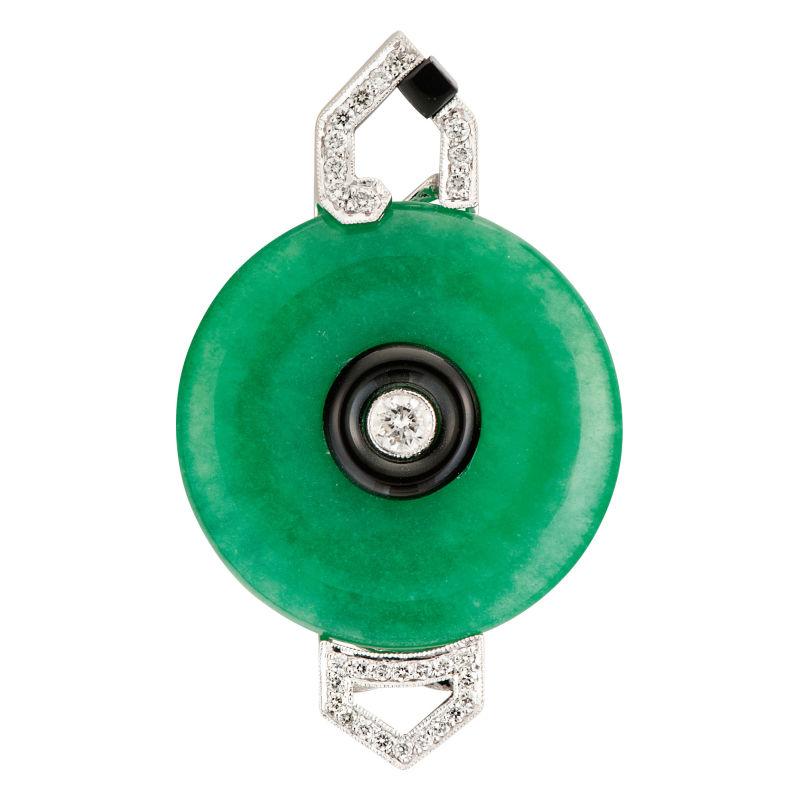 Handsome design as green jade circle, accented by onyx with one brilliant-cut diamond in the center weighing 0,32 ct. Decorated with 29 brilliant-cut diamonds weighing 0,40 ct. Mounted in 18 K white gold. Marked on the back with the purity 18K.
