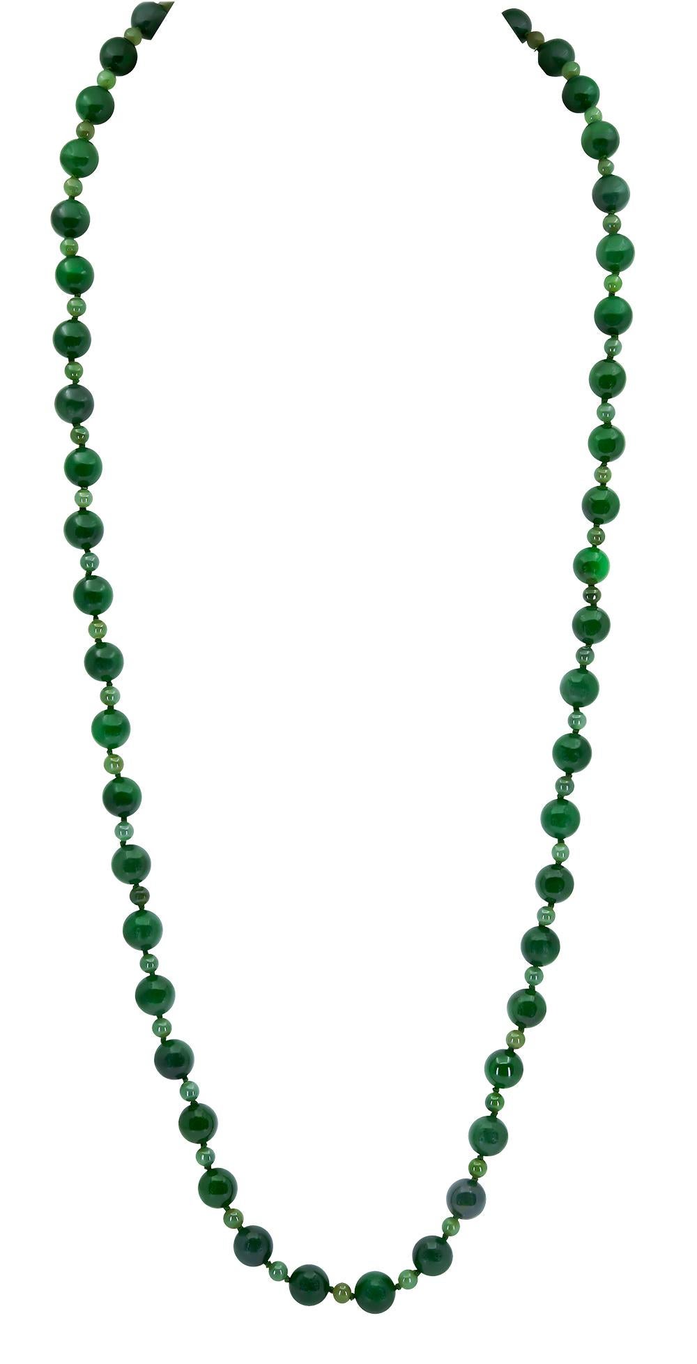 A 35 inch Jade Necklace with 10 mm round Green Jade Beads separated by 5mm lighter Green Jade beads making a subtle and elegant look.    These Jade beads were purchased as part of an estate before being made into this classic necklace.           

