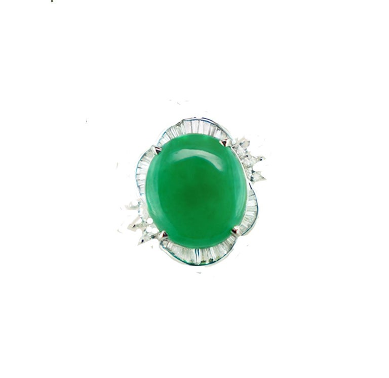 Spectacular, oval-shaped cabochon cut natural jadeite and diamond ring styled as a Ballerina ring.
 The center stone is measured at 18.50 x 16.30 x 5.45 mm.
 The estimated weight of the ring is 15 carats.

Jadeite
The color is green with good