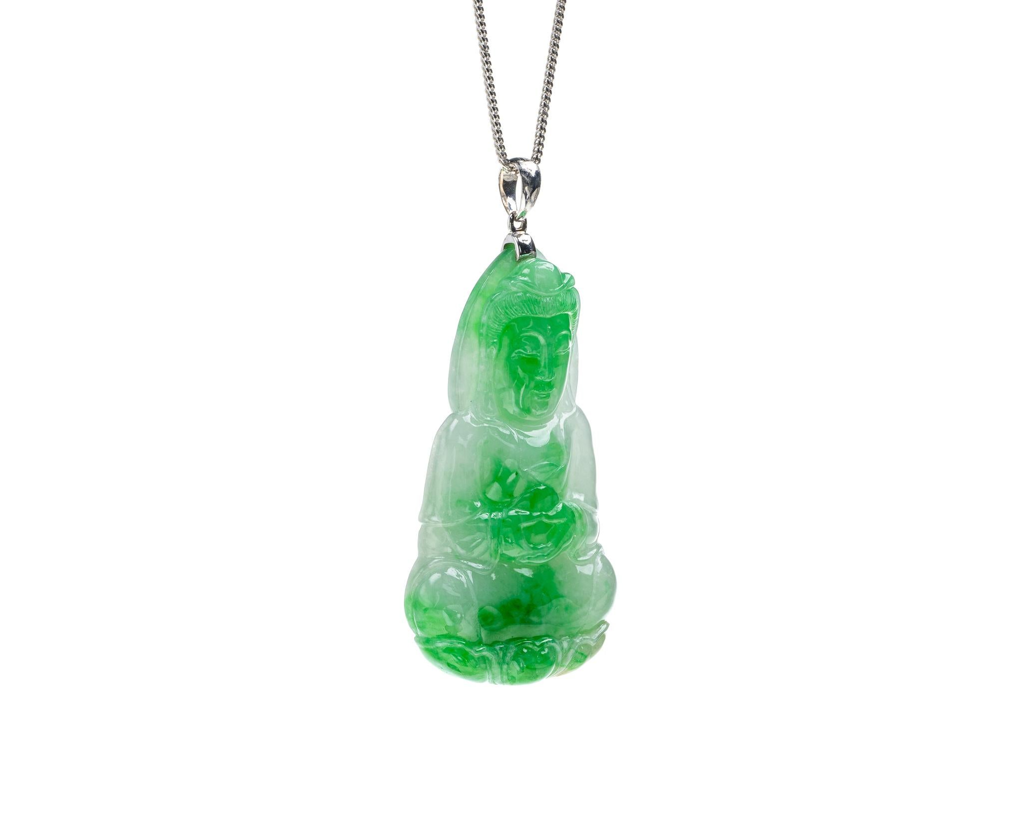 This is an all natural, untreated green jadeite jade carved Quan Yin god pendant set on an 18K white gold bail.  The carved Quan Yin god symbolizes compassion and protection 

It measures 1.07 inches (27.3 mm) x 1.98 inches (50.4 mm) with thickness