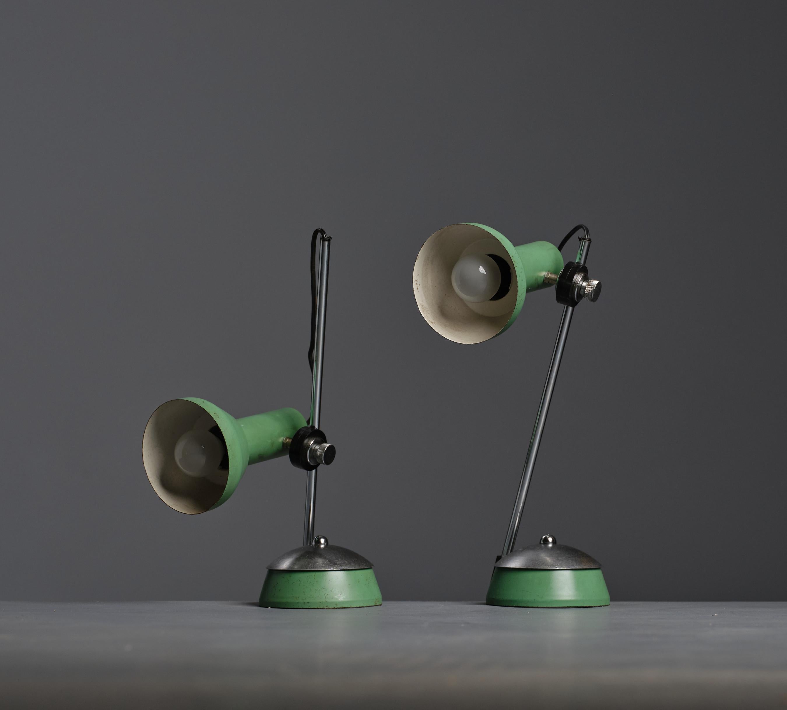 Discover the perfect blend of vintage charm and modern aesthetics with this remarkable pair of 70's table lamps. These eye-catching lamps feature a delightful green hue complemented by stylish steel accents, exuding timeless elegance and