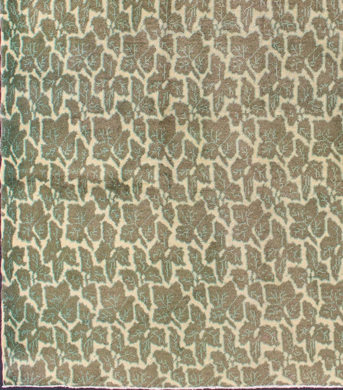 Measurements: 7' x 8'8.
Rendered in green and soft yellow tones with a leaf pattern, this mid-century patterned rug is unique in both color palette and design, rendering it a great fit for modern, transitional, classic and casual