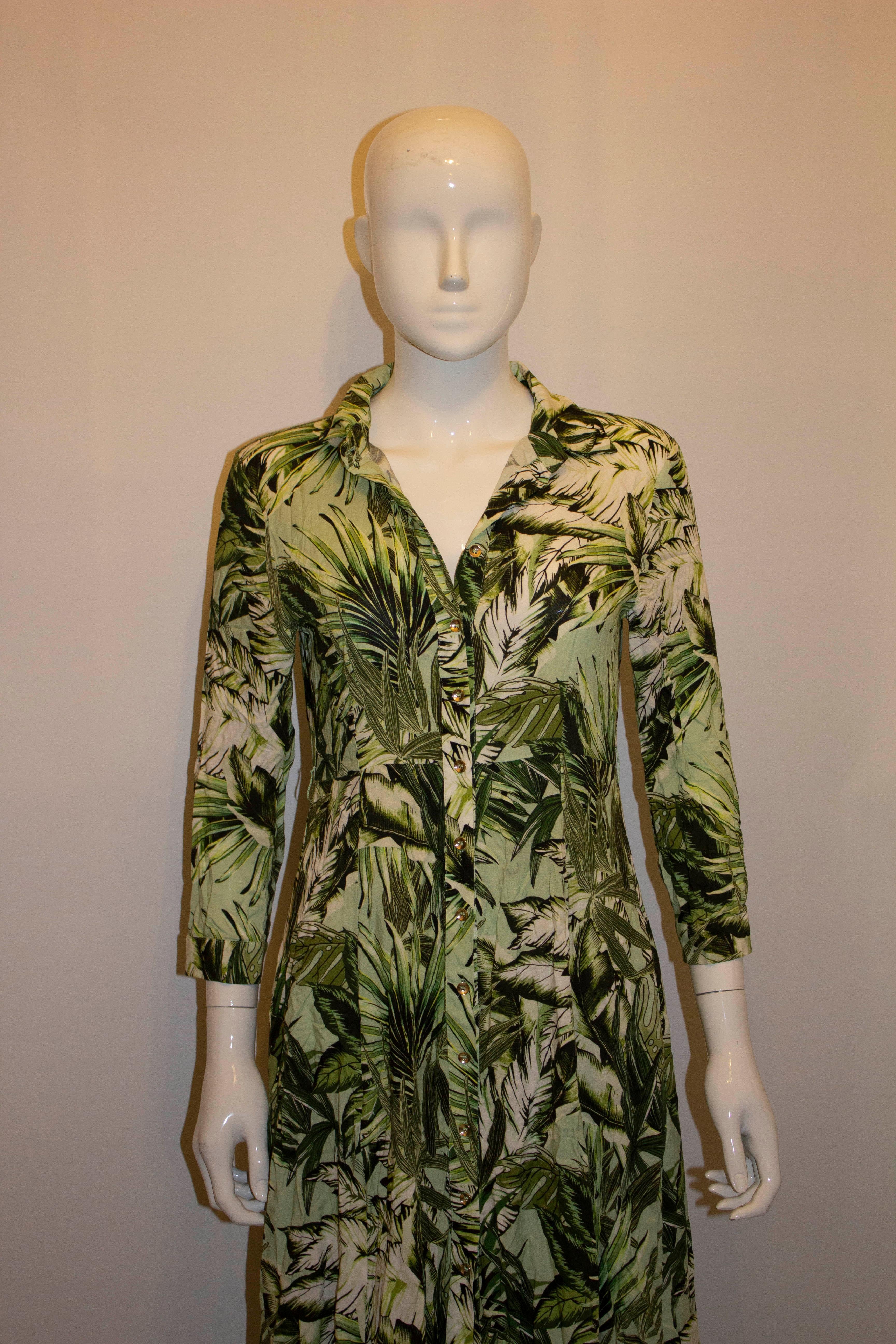 A lovely dress for Spring by Aggi , the luxury Polish brand. The easy to wear dress is in  a green print, is unlined and measures Bust 36'',  length 52''