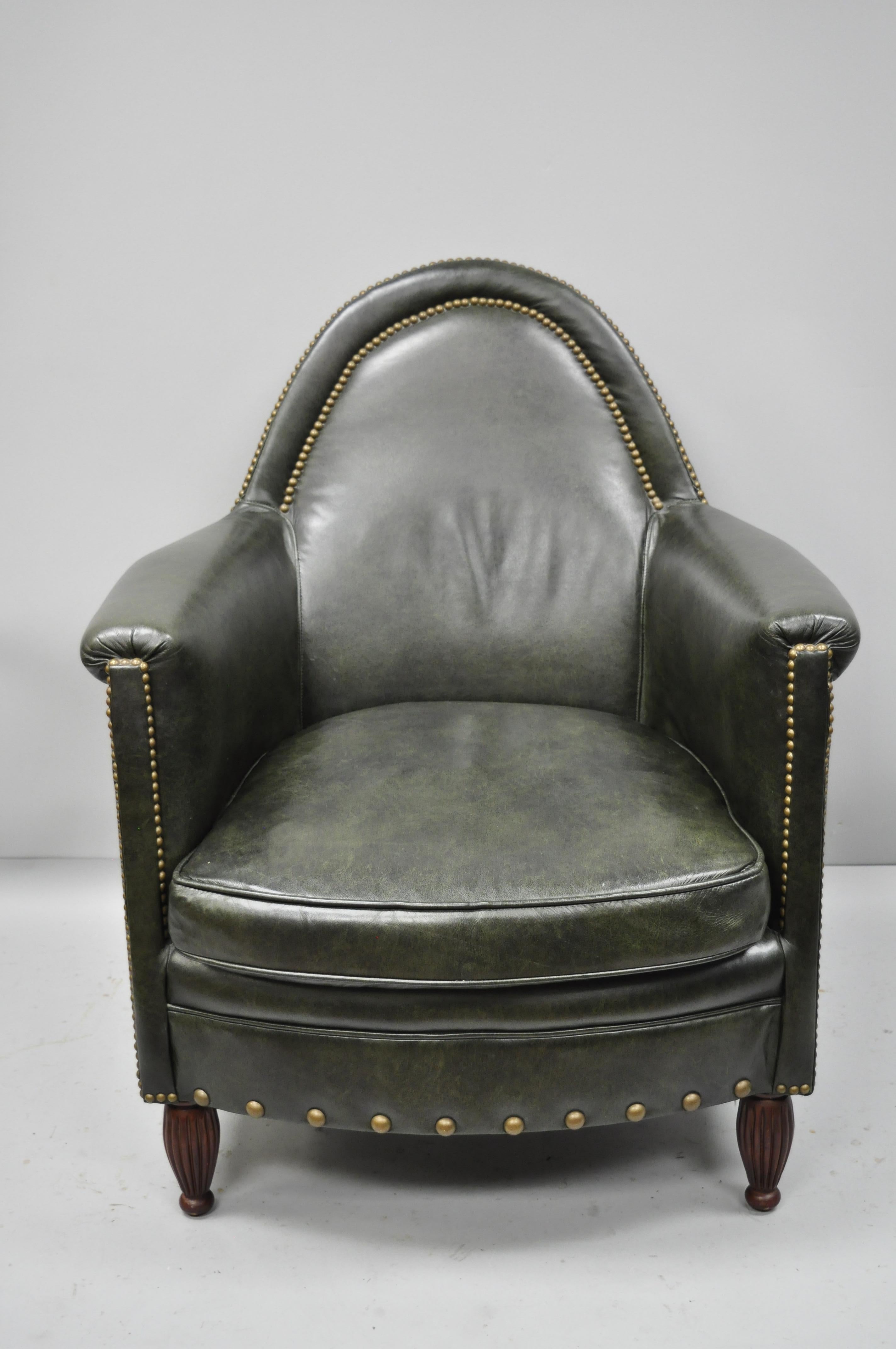 Green leather lounge club chair armchair and ottoman by Bradington Young. Items feature nailhead trim, tapered wooden legs, unique oval shape, original label, and quality American craftsmanship, circa late 20th century. Measurements: 38.5