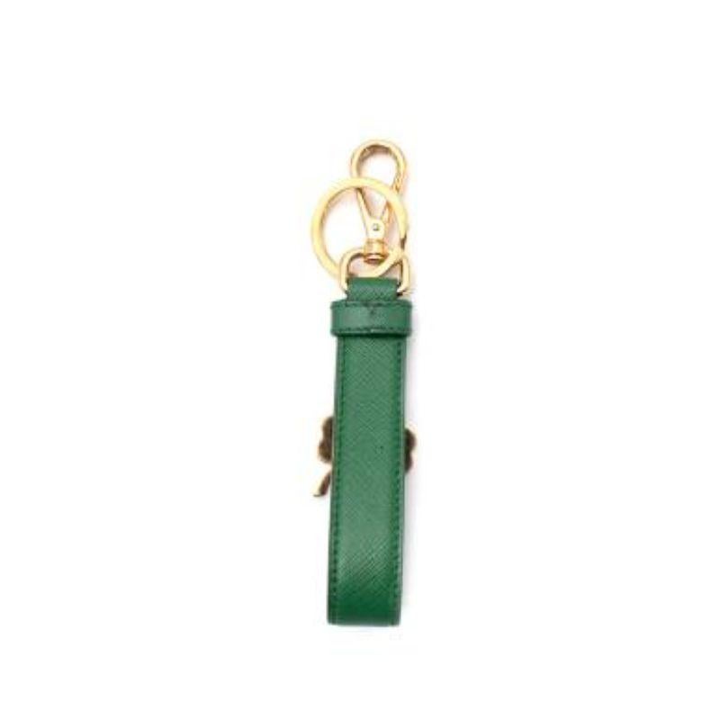 Prada green leather Lucky Charm keyring
 

 - Green Saffiano leather tab with gold-tone metal clip and enamel-coated 4 leaf clover charm
 

 Materials:
 Leather 
 Metal 
 

 Made in Italy 
 

 9/10 very good condition, with minor signs of wear,
