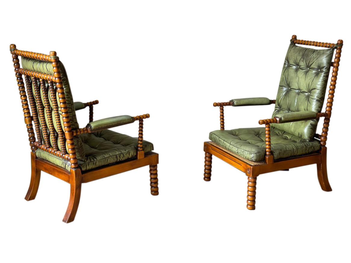 Mid-century Spanish pair of bobbin chairs signed by Valenti.
Original tufted green leather seat and back.
Leather arm rests.
Arriving August.