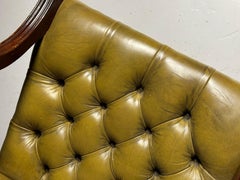 Green leather upholstered office chair