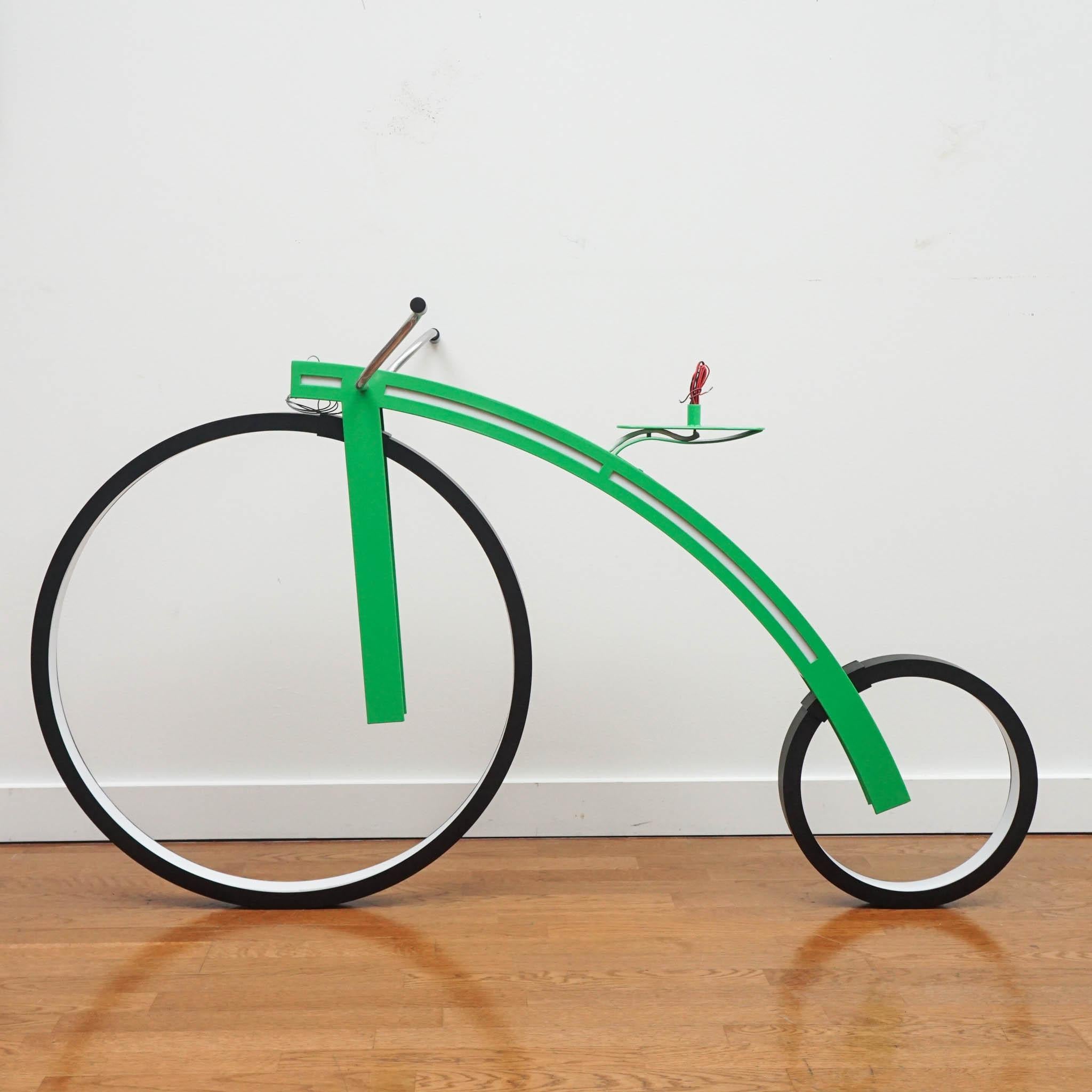 This fun and unique bicycle light is the highlight of any room! With illuminated LED wheels and a bright green color, this fixture is a modern masterpiece. 

 Hanging hardware and canopy not included.