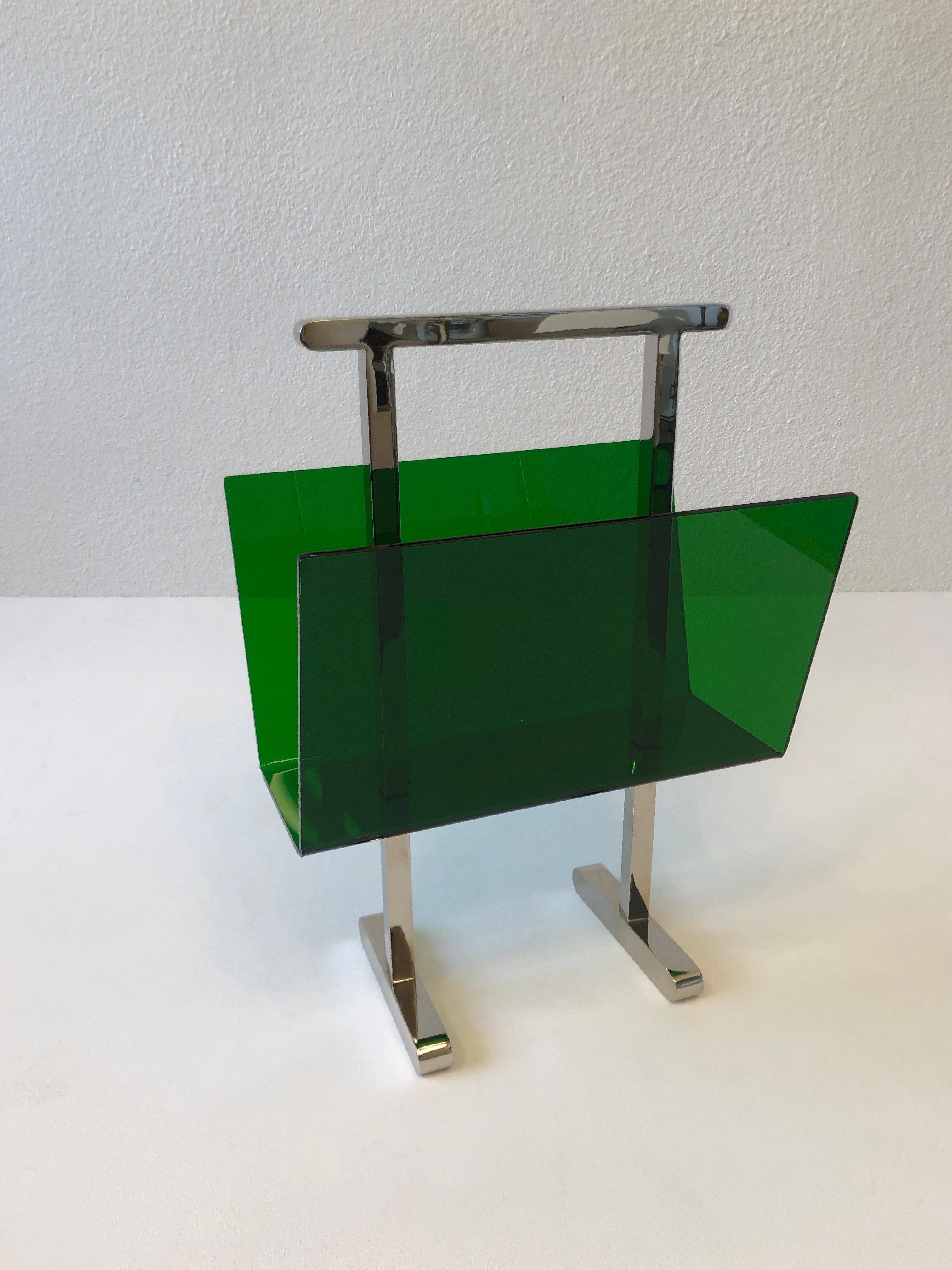 Green lucite and polish nickel magazine holder by American renowned designer Charles Hollis Jones. Part of CHJ new line of colored lucite designs. Available in other colors. 
Measurements: 9.25” Deep, 14.5” Wide, 20” High.