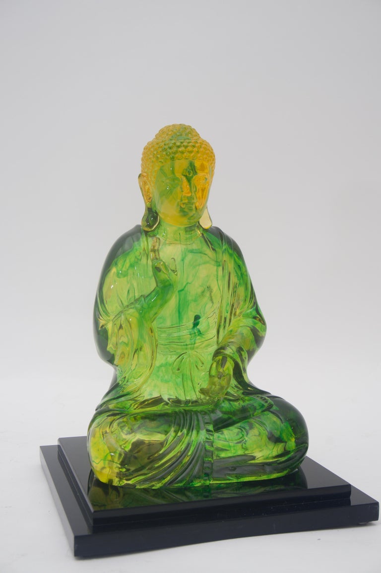 This stylish and chic Buddha figure has been professionally mounted on a custom black Lucite base which contrast beautifully with the translucent citrine green and golden coloration.
