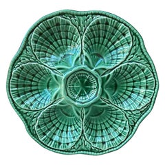 Assiette  hutres en majolique verte Sarreguemines, vers 1930
