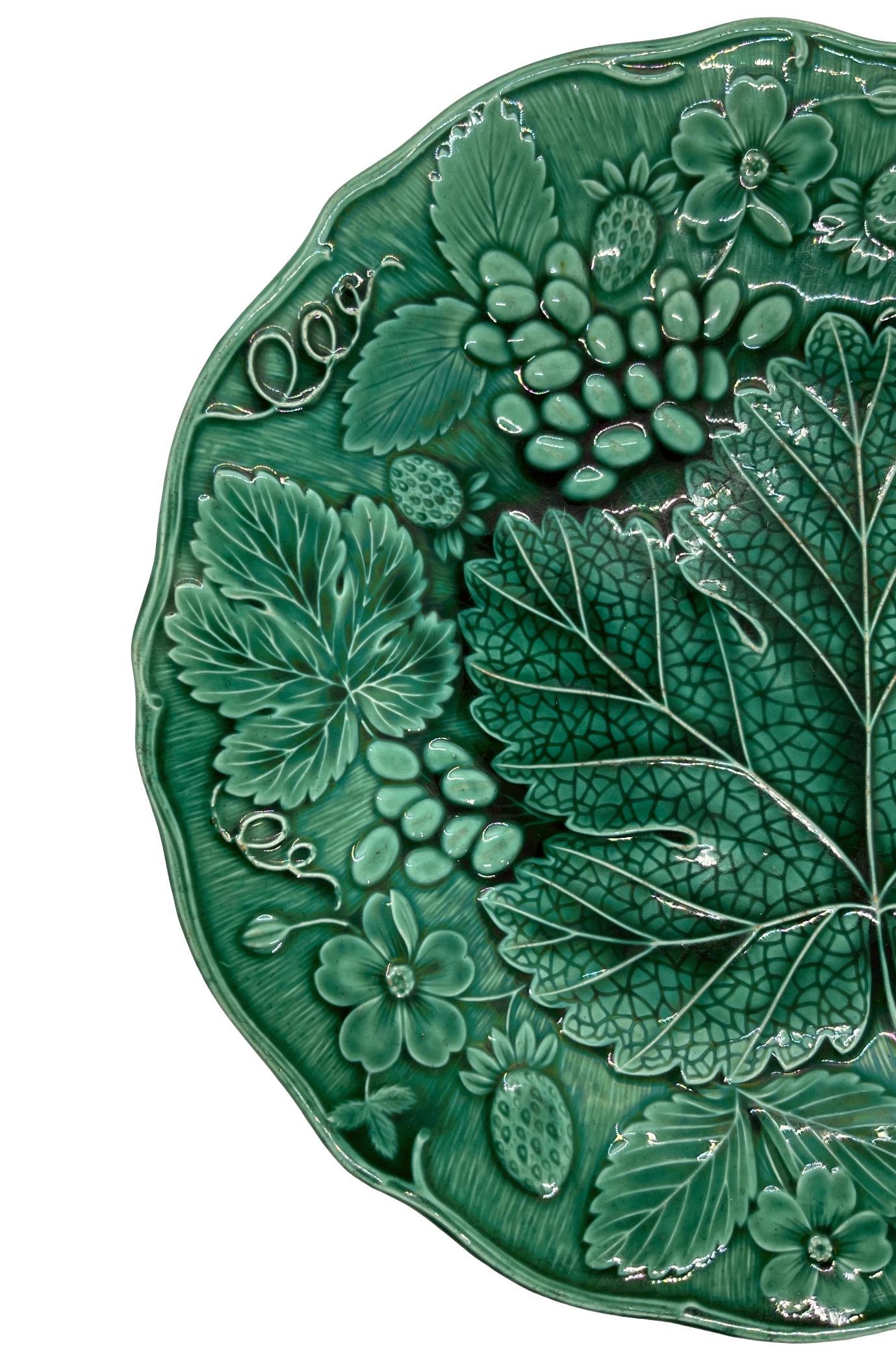 Green Majolica dessert plate, molded with strawberries and grapes, English, ca. 1880.