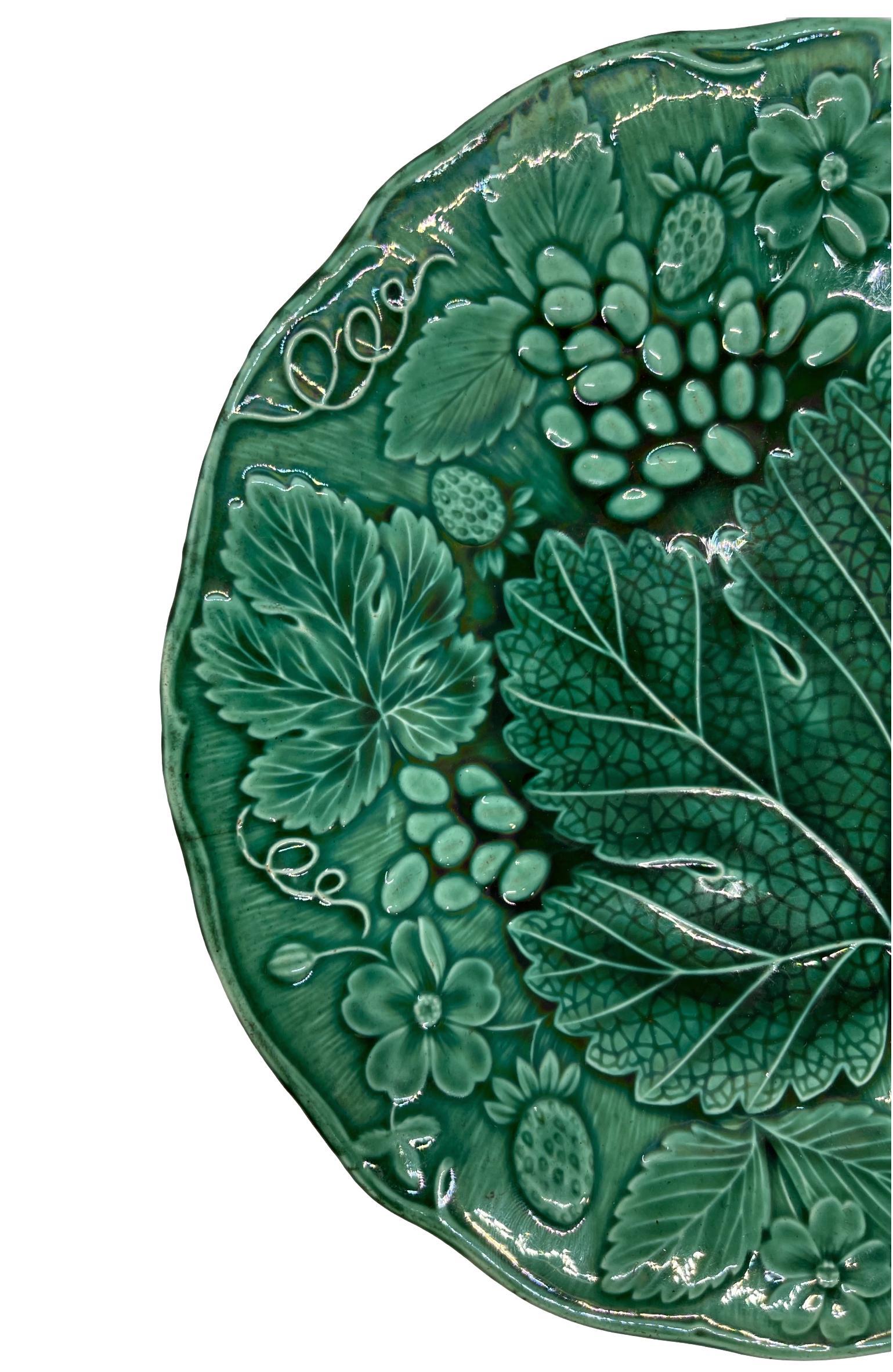 Green Majolica strawberry dessert plate, English, molded with strawberries and strawberry leaves, English, ca. 1880.