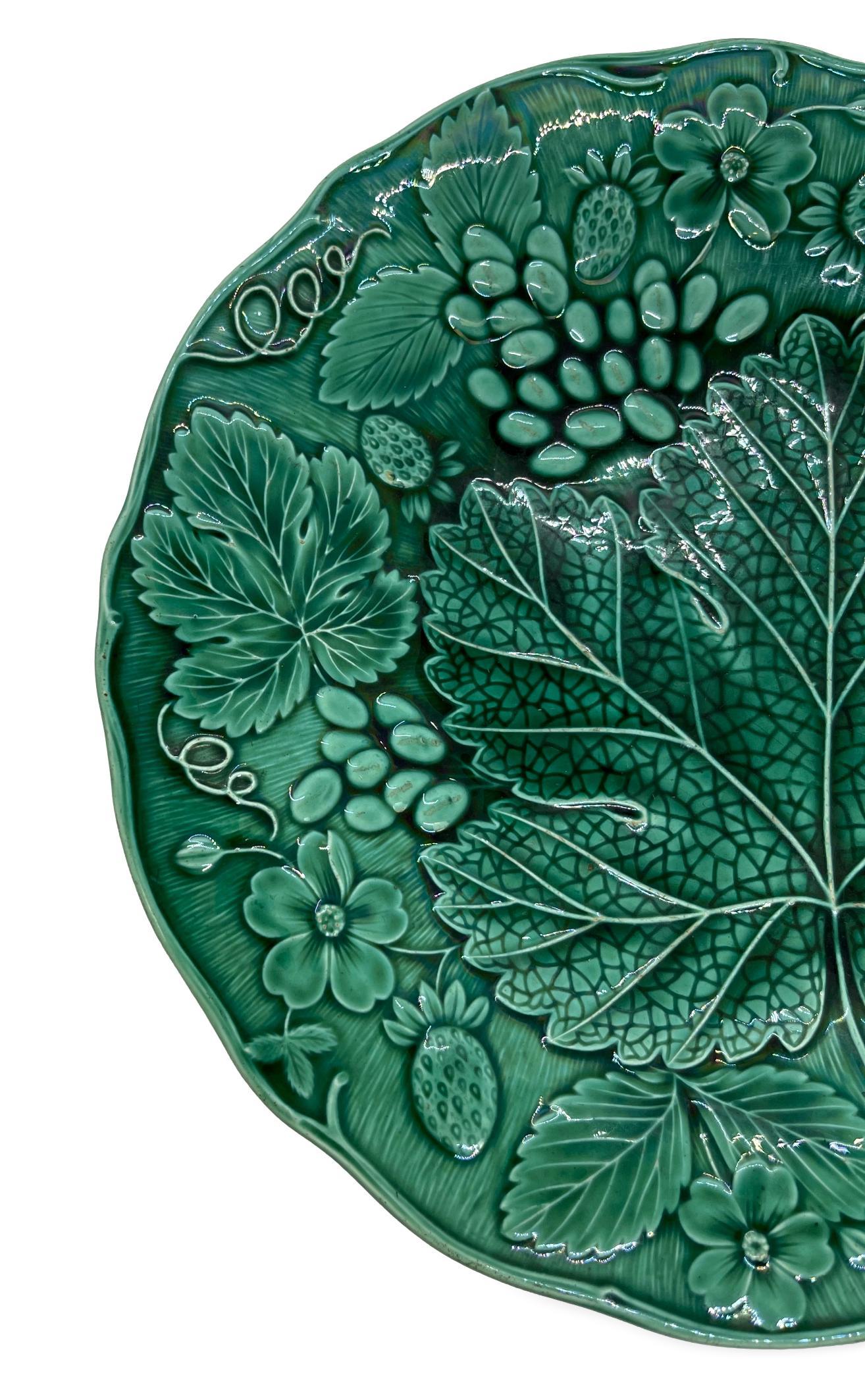 Green Majolica strawberry dessert plate, English, molded with strawberries and strawberry leaves, English, ca. 1880.