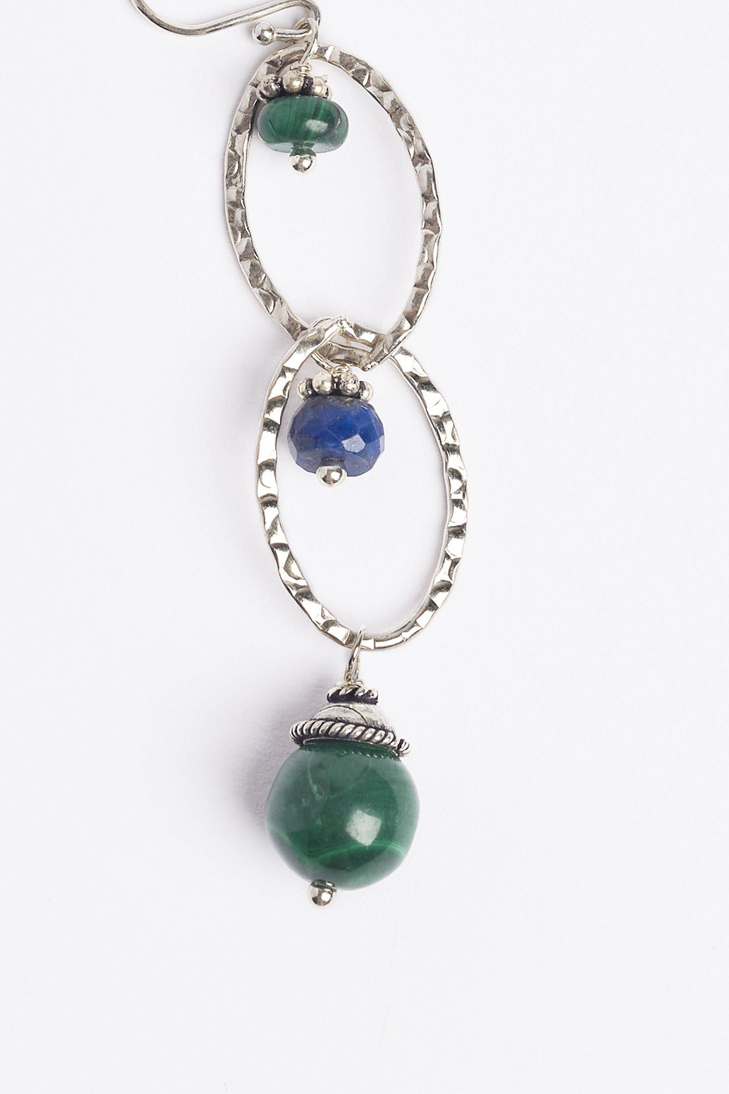 The hammered sterling silver earrings are accented with blue lapis and green malachite.

Materials
Lapis, Malachite, Sterling Silver

Dimensions
2.75