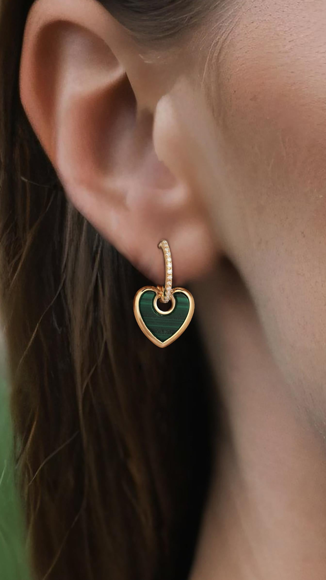 Elevate your jewelry collection with the Green Malachite Heart Diamond 14K Yellow Gold Drop Earrings. These exquisite earrings feature a stunning combination of natural diamonds, malachite, mother of pearl, and coral, creating a unique and vibrant