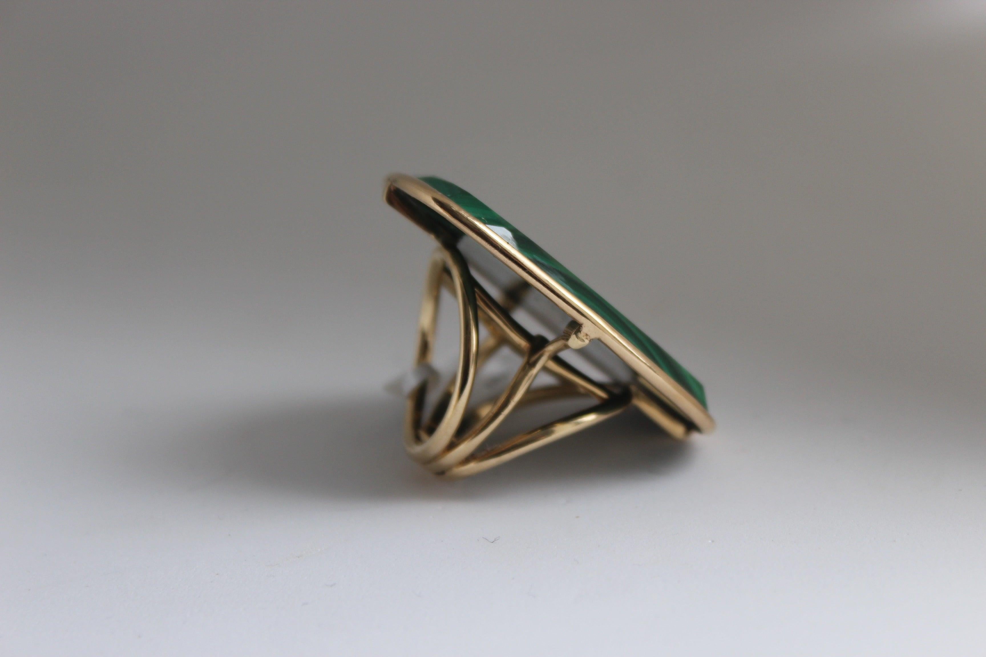 Make a statement with this beautiful malachite ring! 
Featuring a large cut of malachite set in 14K Yellow Gold, you can't go wrong with this piece! 